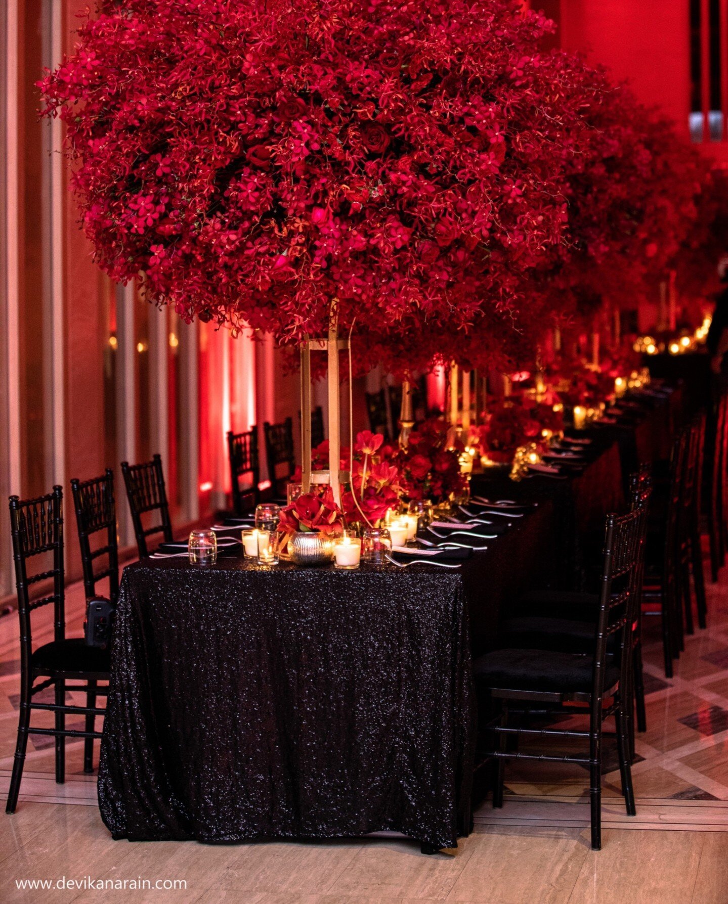 A spy's banquet.
A hundred foot long table was set along the halls clad in black sequins. Three thousand stems of red mokaras made the dramatic centerpieces that could practically kiss the ceiling.
Mithila + Karan
Phuket
March 2022 

Design and Conce