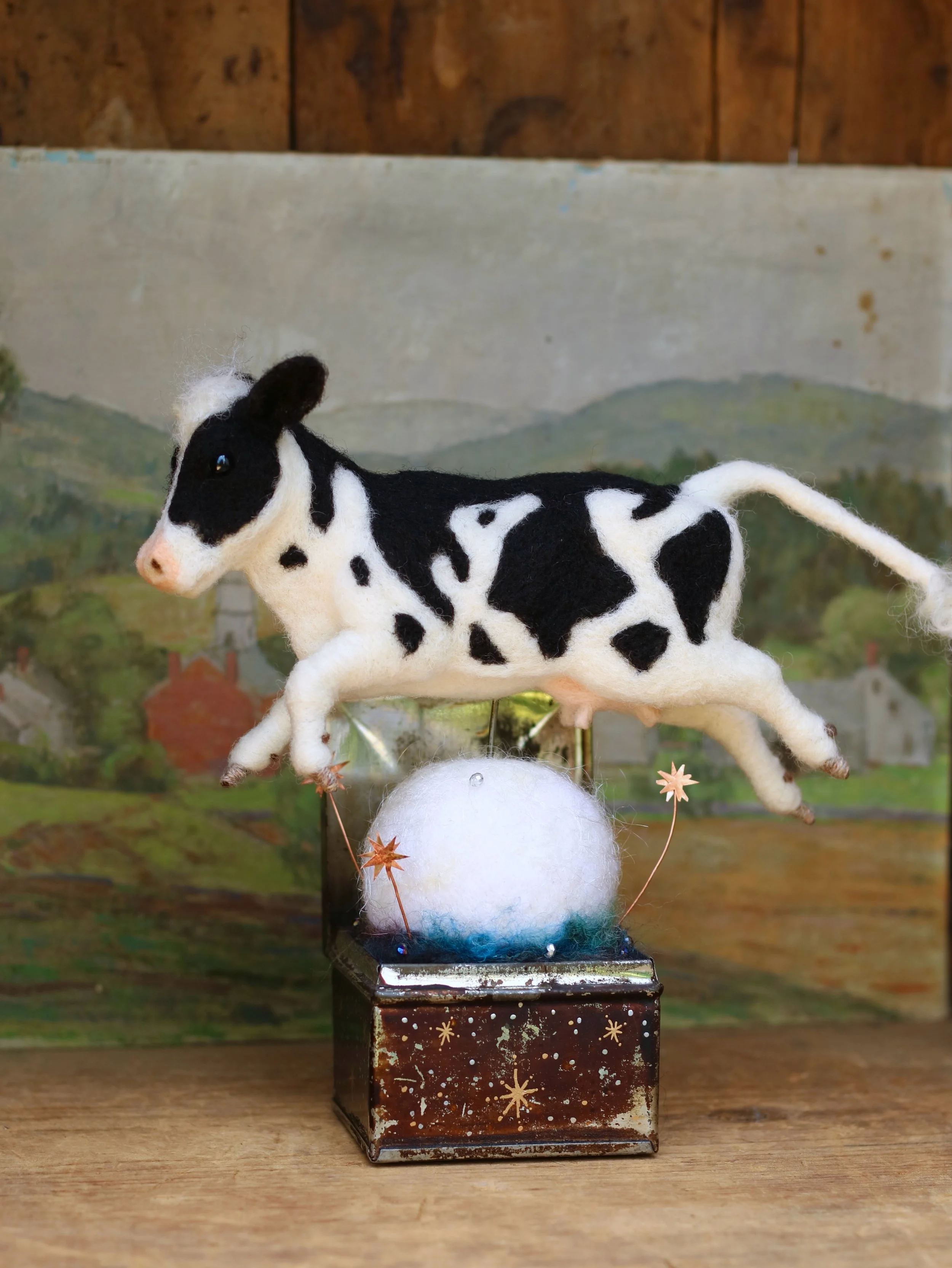 I&rsquo;m over the moon to share with you, &ldquo;Over The Moon&rdquo;! Inspired by the traditional English nursery rhyme, this piece combines a variety of materials to create a joyful, whimsical scene. It&rsquo;s starts with an old tin box, added to