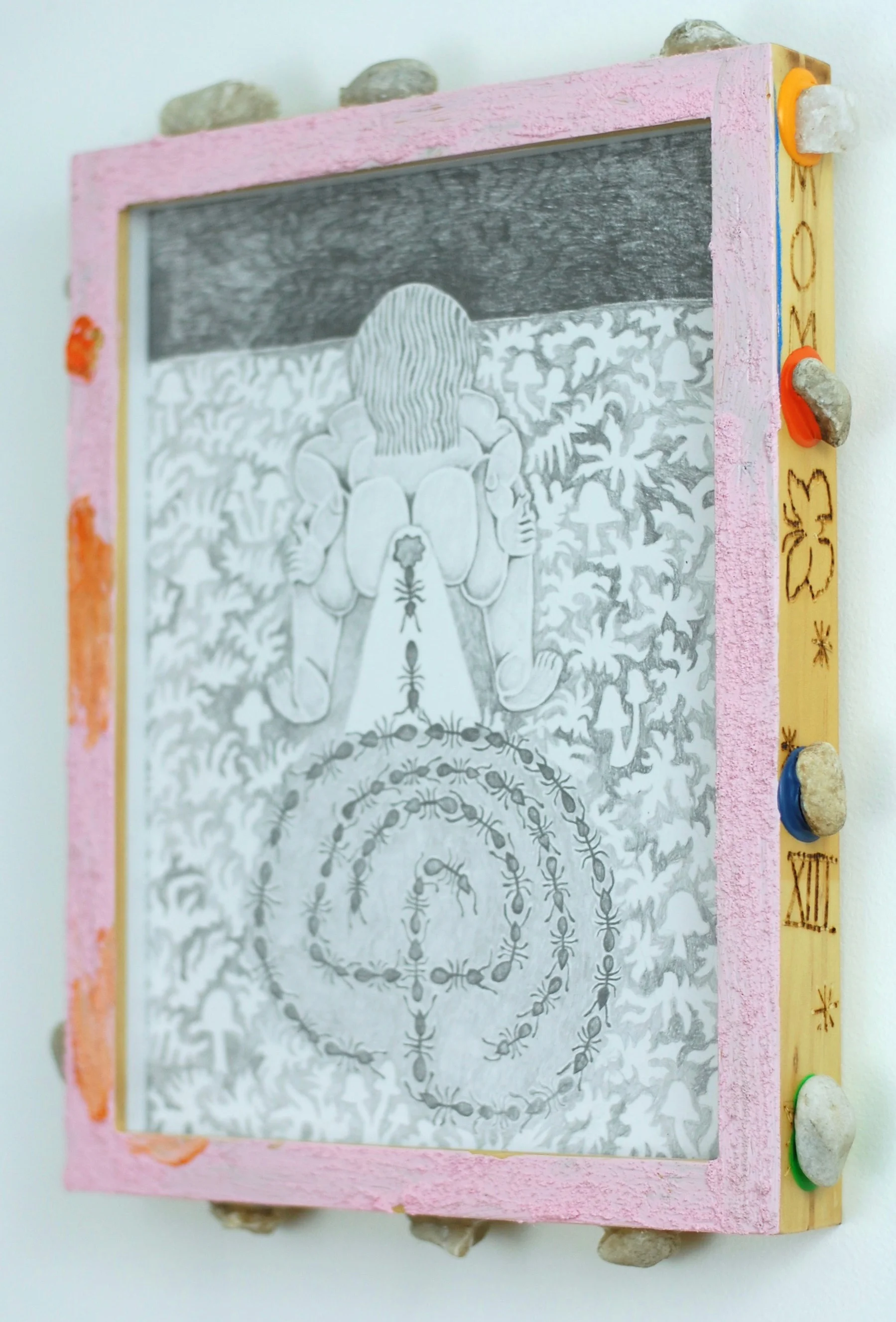 I walked the walls and not the labyrinth . 2018. Graphite on paper with acrylic, pumice, pebbles from back yard, and heat carving on wooden frame. 9x12in.