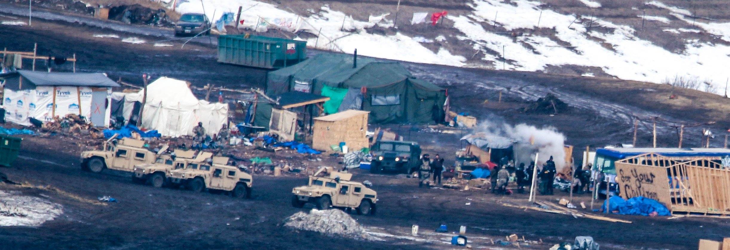 Evacuation Oceti Sakowin Camp, Law Enforcement Agents Extinguishing the Sacred Fire - February 23rd, 2017 - By MK