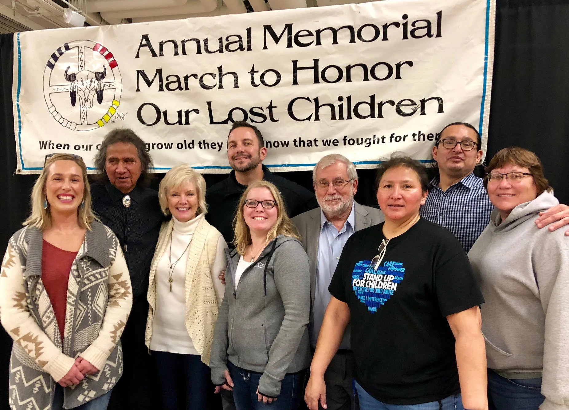 The organizers of the March to Honor Lost Children pose for a picture. From left to right: Erin Binneboese, Frank LaMere, Kim Jenkins, Matt Ohman, Kim Wilson, Tom Bouska, Kellie Snow, Micheal O’Connor, Val Uken.