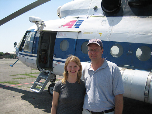 Paul and Meghan in front of a helicopter_Armenia.jpg