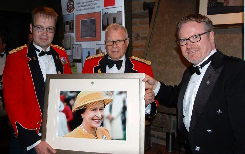 Presentation of a print to Lt. Col. Best and Hon. Col. Newman to celebrate Her Majesty's Diamond Jubilee in 2012. The photograph is of Her Majesty wearing Her 48th Highlanders of Canada Regimental brooch at Fort York National Historic Site in 1984. A pretty good photo for a grade 11 student just learning how to use a camera!