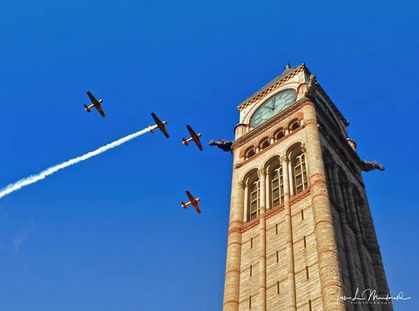 The Missing Man formation above the Old City Hall clock tower, Toronto. Remembrance Day 2016