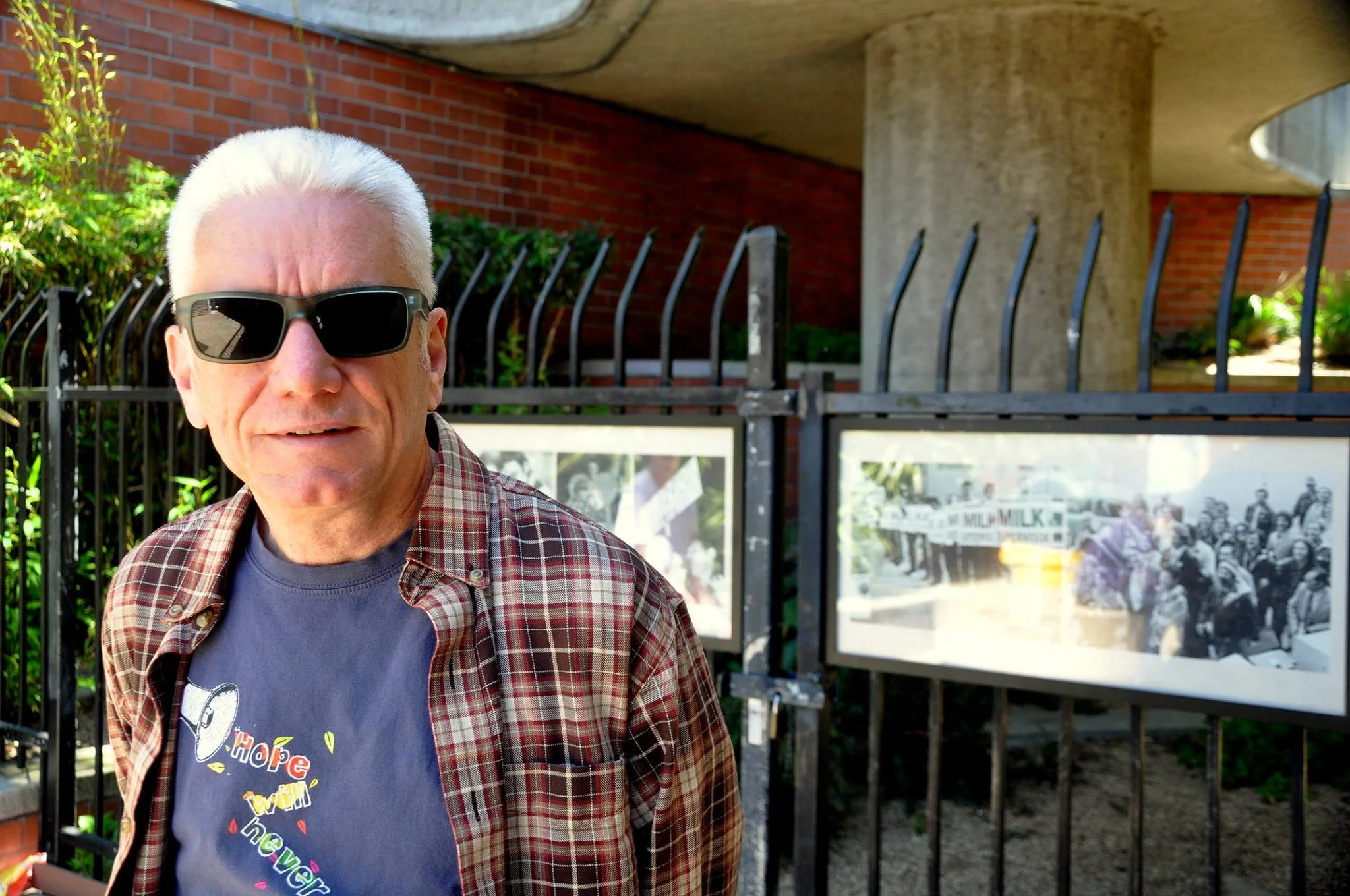 Danny in front of some of his images at Harvey Milk Plaza, outside the Castro Muni Station.