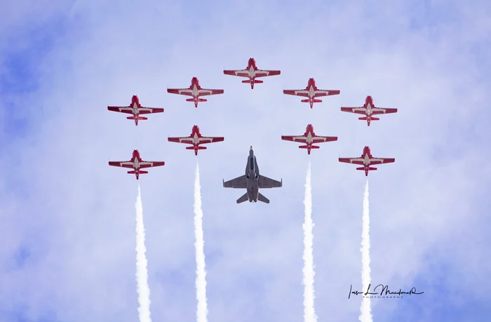 Canada's world famous Snowbirds with a 2017 'Canada 150' decorated CF-188 Hornet fighter jet