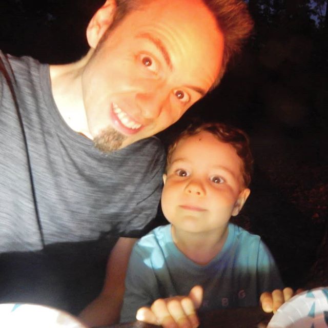 Just hanging out with my dad around the campfire waiting for dinner! did you watch our new video to see our camping fun? Link in bio! @thetravelvlogfamily #travelvlog #family