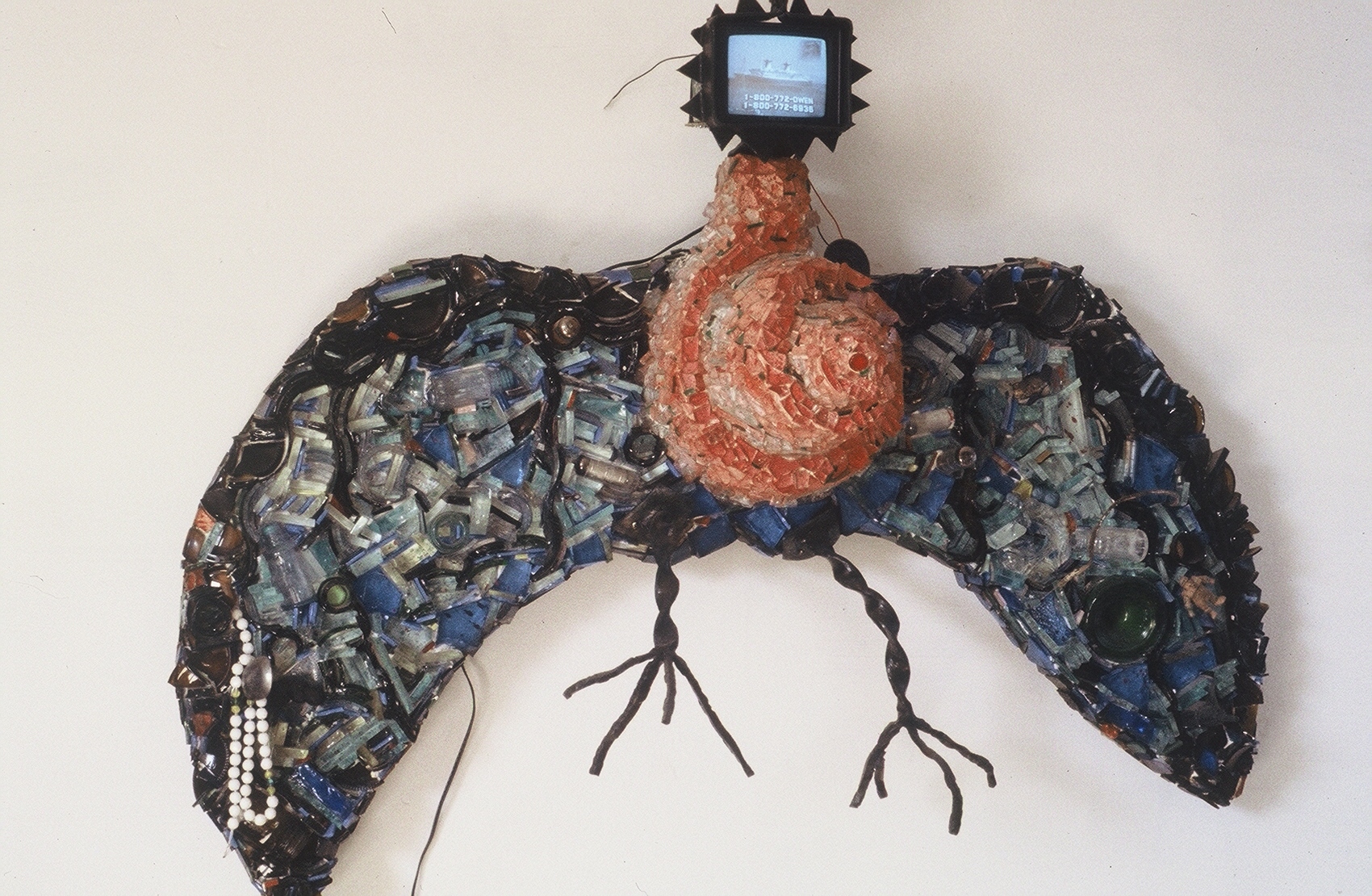 TV Headed Bird, 1995. Recycled glass, cement, steel, small CRT TV. ~36"H x 50"W x 12"D