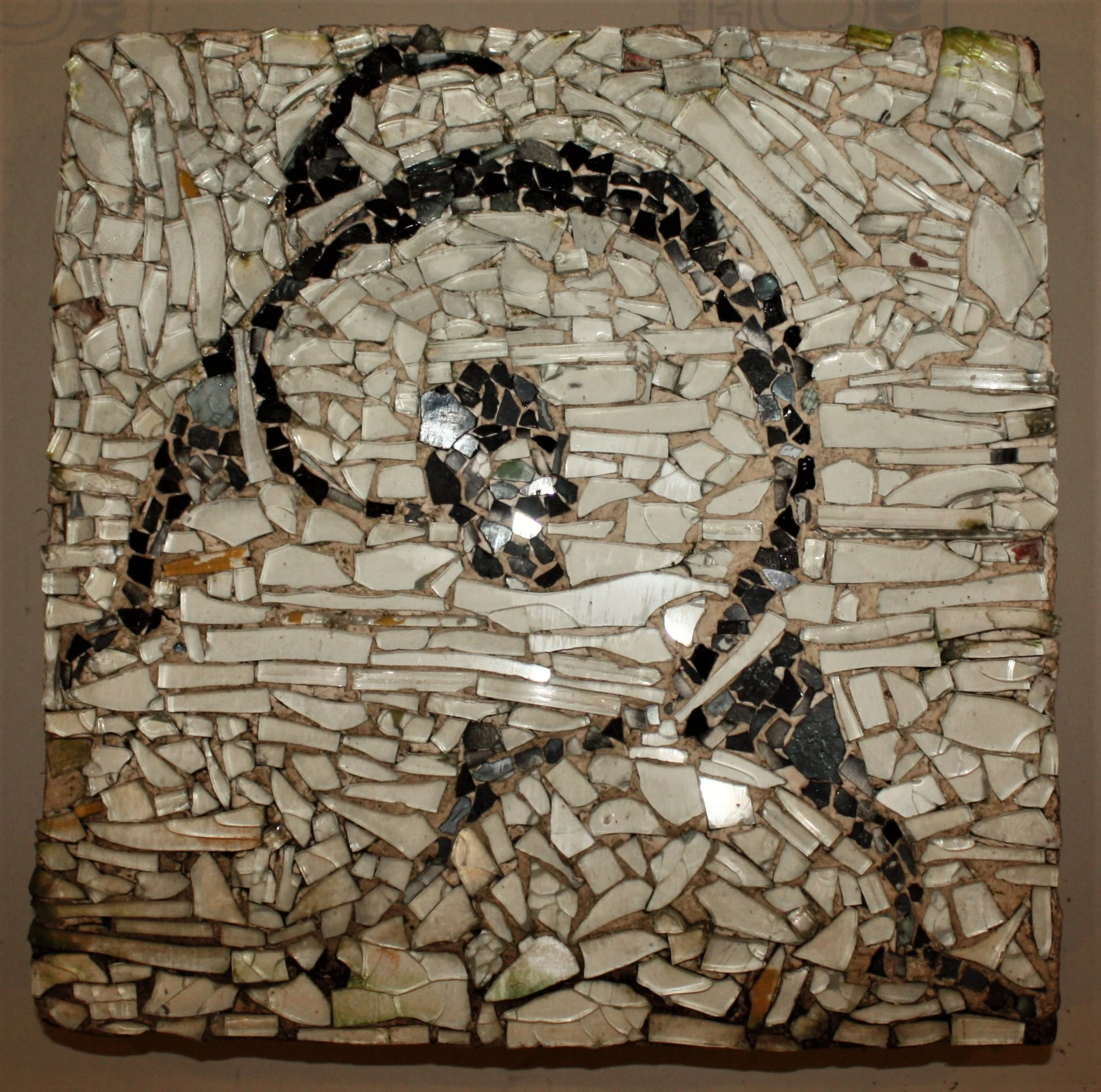 Dancer 2, 1988. Recovered auto glass on paving brick. 12"H x 12"W x 2"D