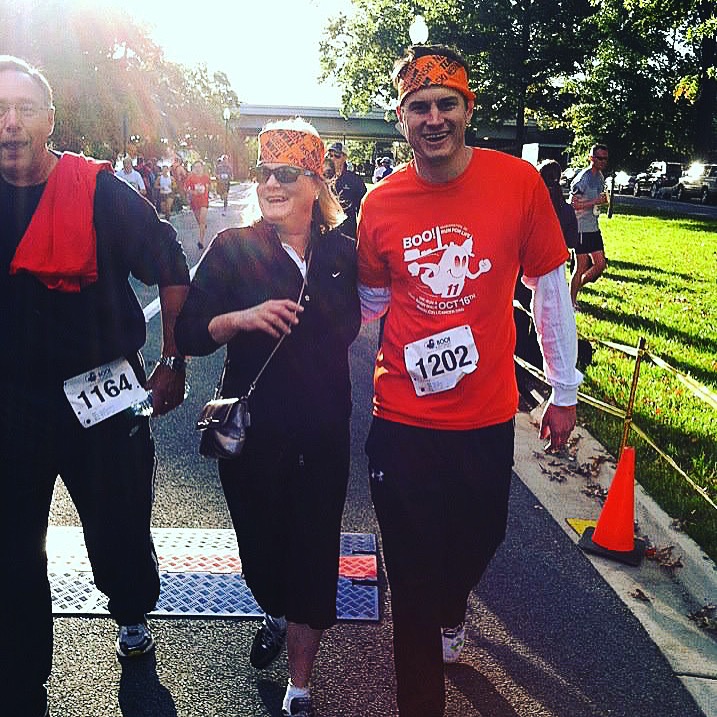 Mom and David crossing finish line.JPG