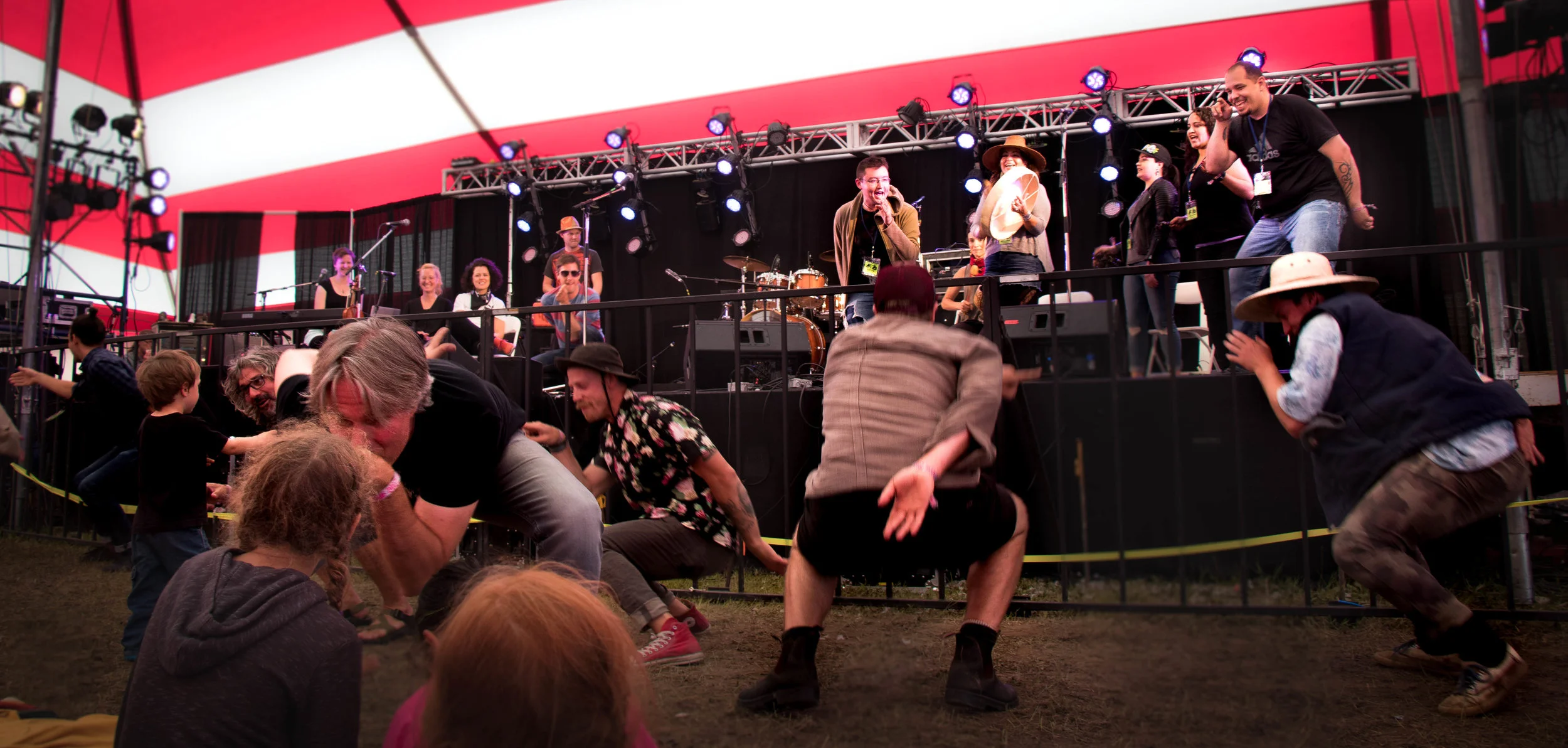 Members of the Dakhká Khwáan Dancers teach crowd members a traditional dance.