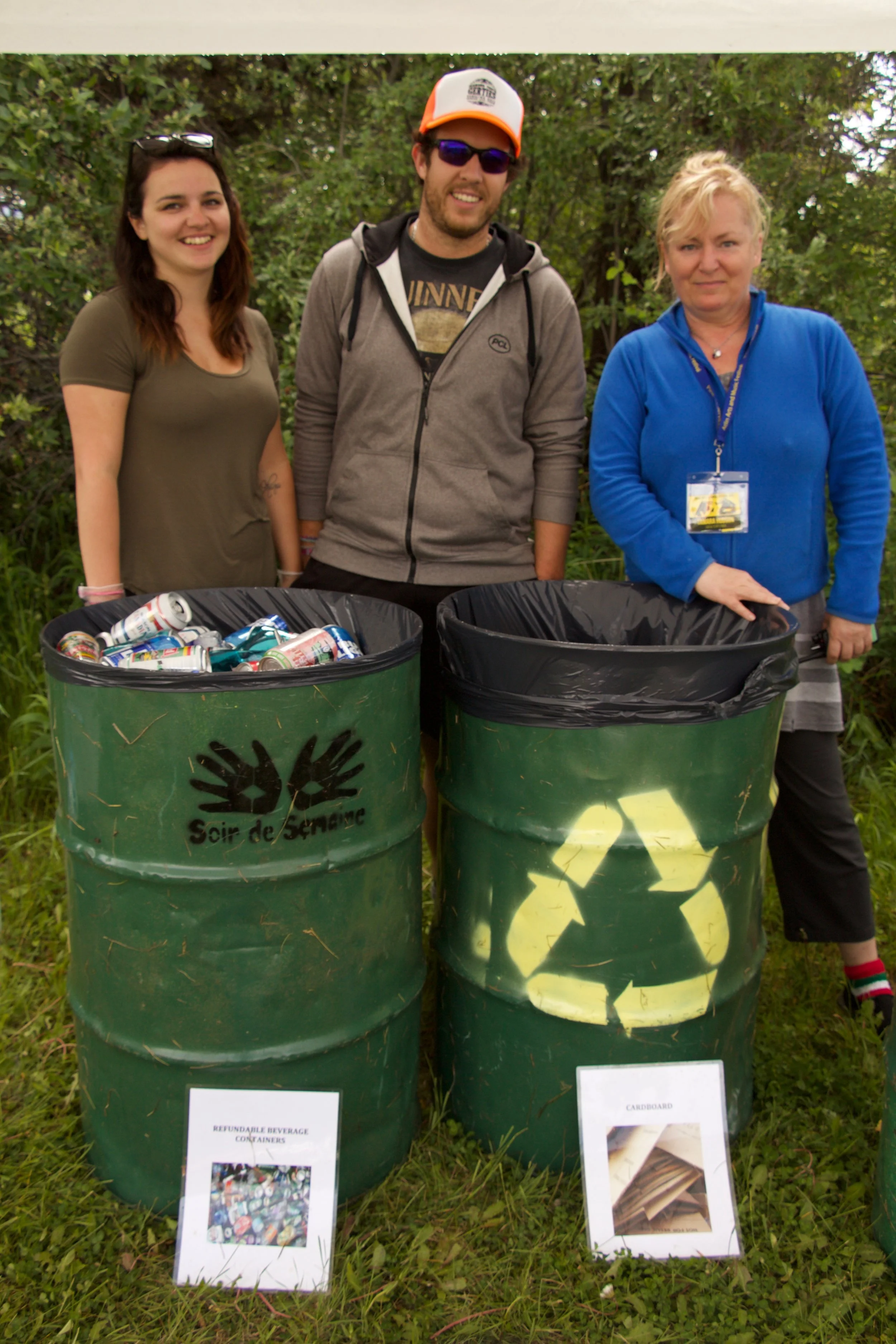 The green team at the Atlin Arts and Music Festival sorts through the recycling. Marissa Dumas and Matt Quinton are volunteers on the team (left and centre), Tamara Hudson (right) is the green team leader.