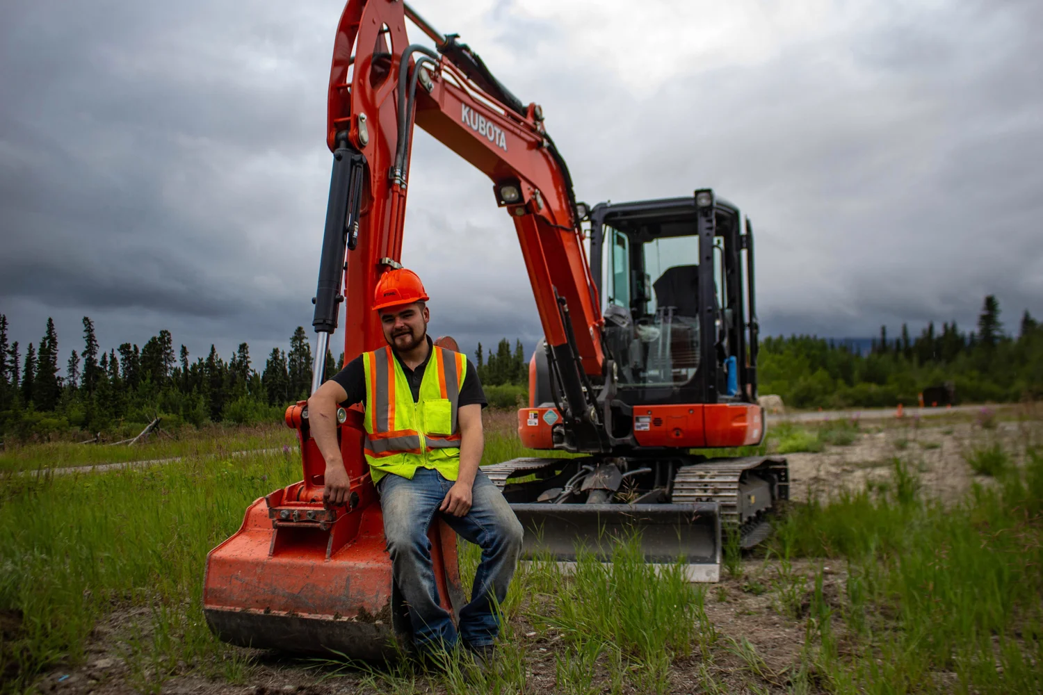 Kashies James excavates soil at the former Chooutla residential school site so it can be tested for toxic material. Photo by Madeline Lines.