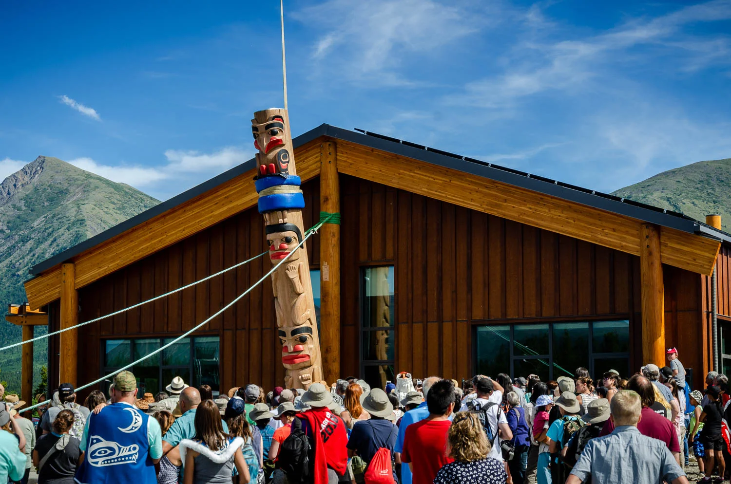 When the story pole is raised, the entire community helps pull the ropes to lift the pole off the ground. 