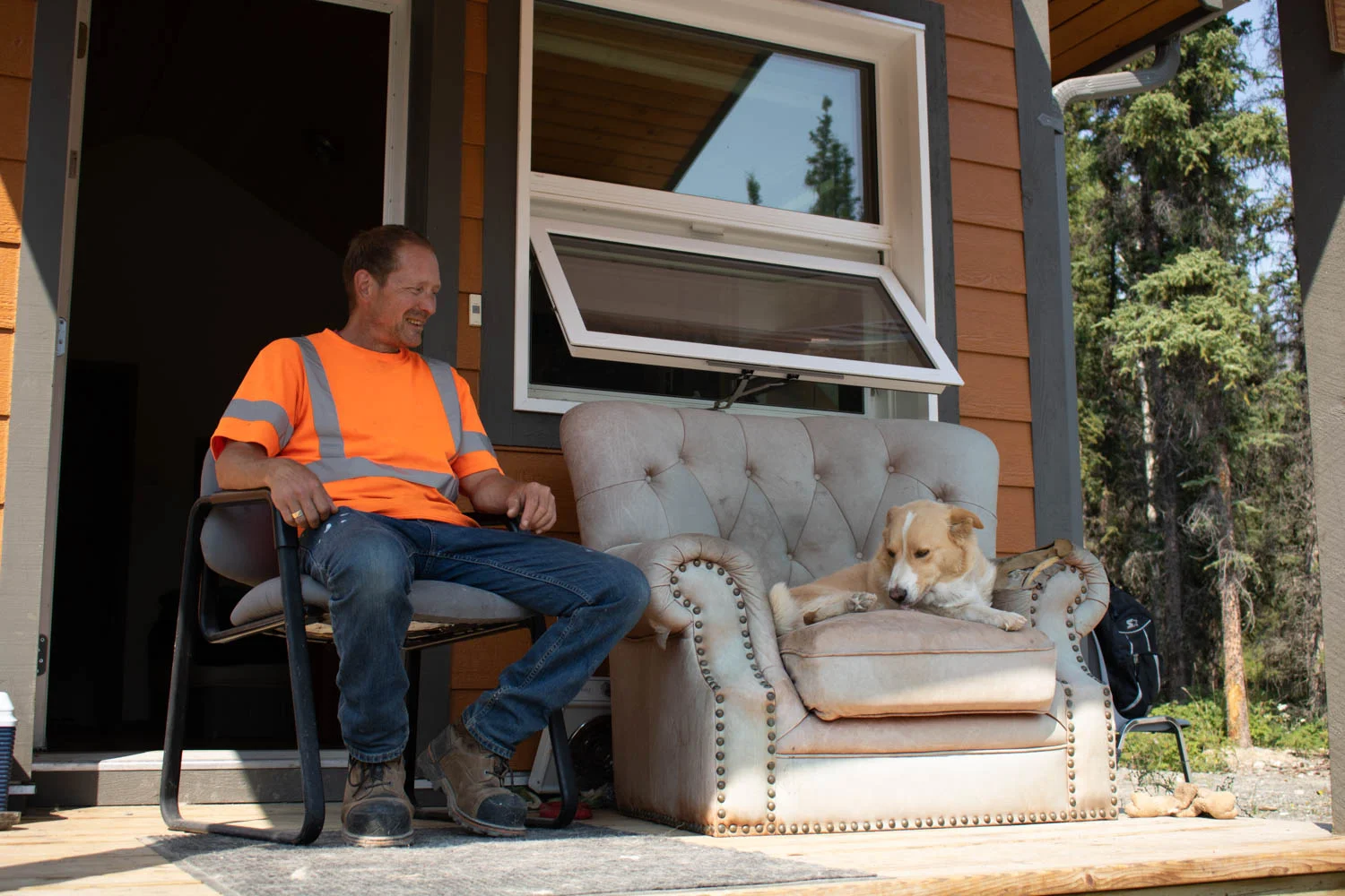 Cory Thompson sits outside his home in Carcross, Yukon.