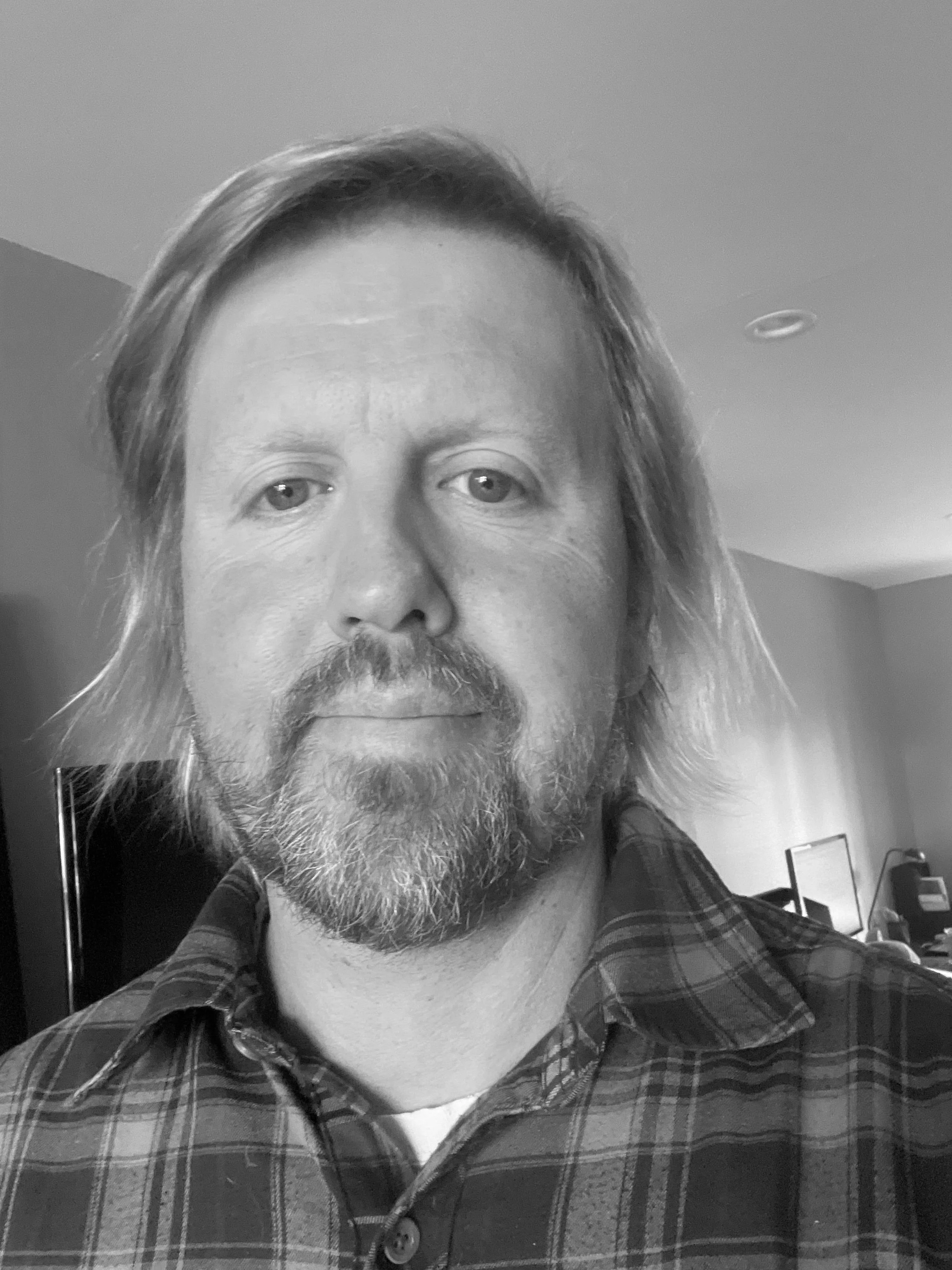 Joel+Flannel+headshot.jpg