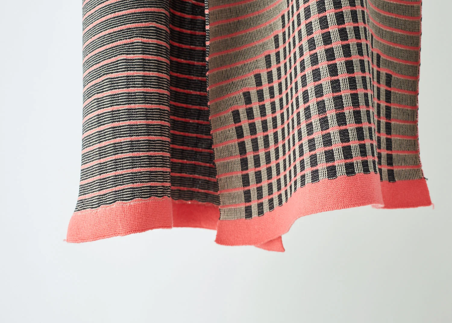 Fluorescent pink and grey knitted textiles pattern