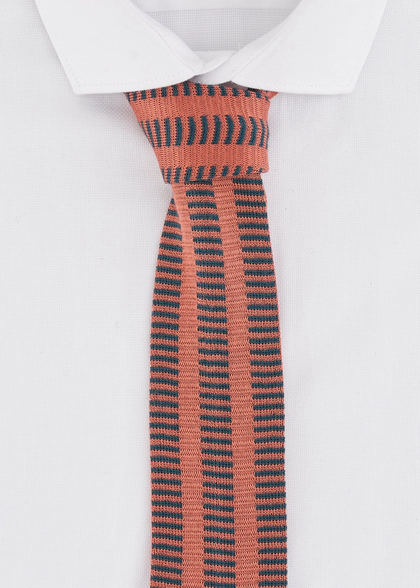 Pink and green bold tie on white shirt