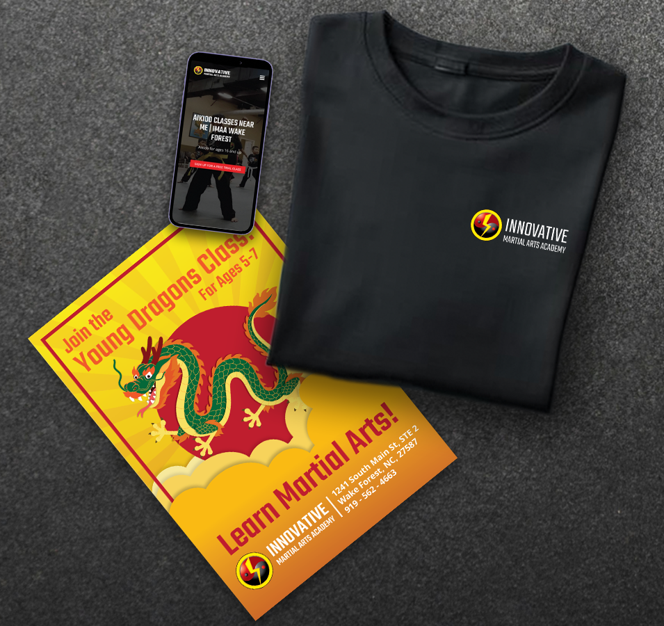 A promotional flyer for Young Dragons martial arts classes with a cartoon dragon, a black t-shirt with the Innovative Martial Arts Academy logo, a smartphone displaying the academy's website, and a martial arts class poster.