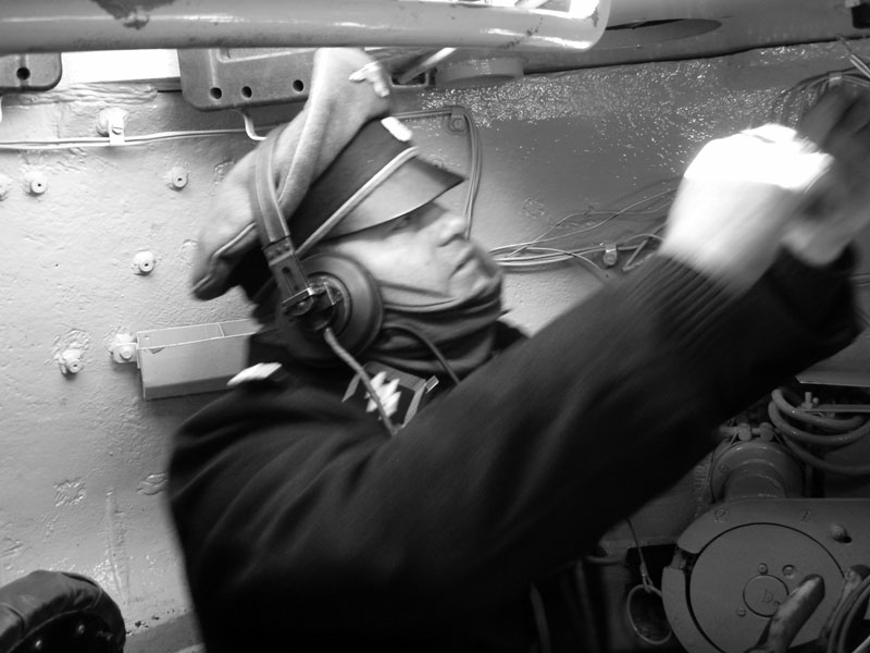 Hauptsturmführer Strandt issues commands from inside his tank.