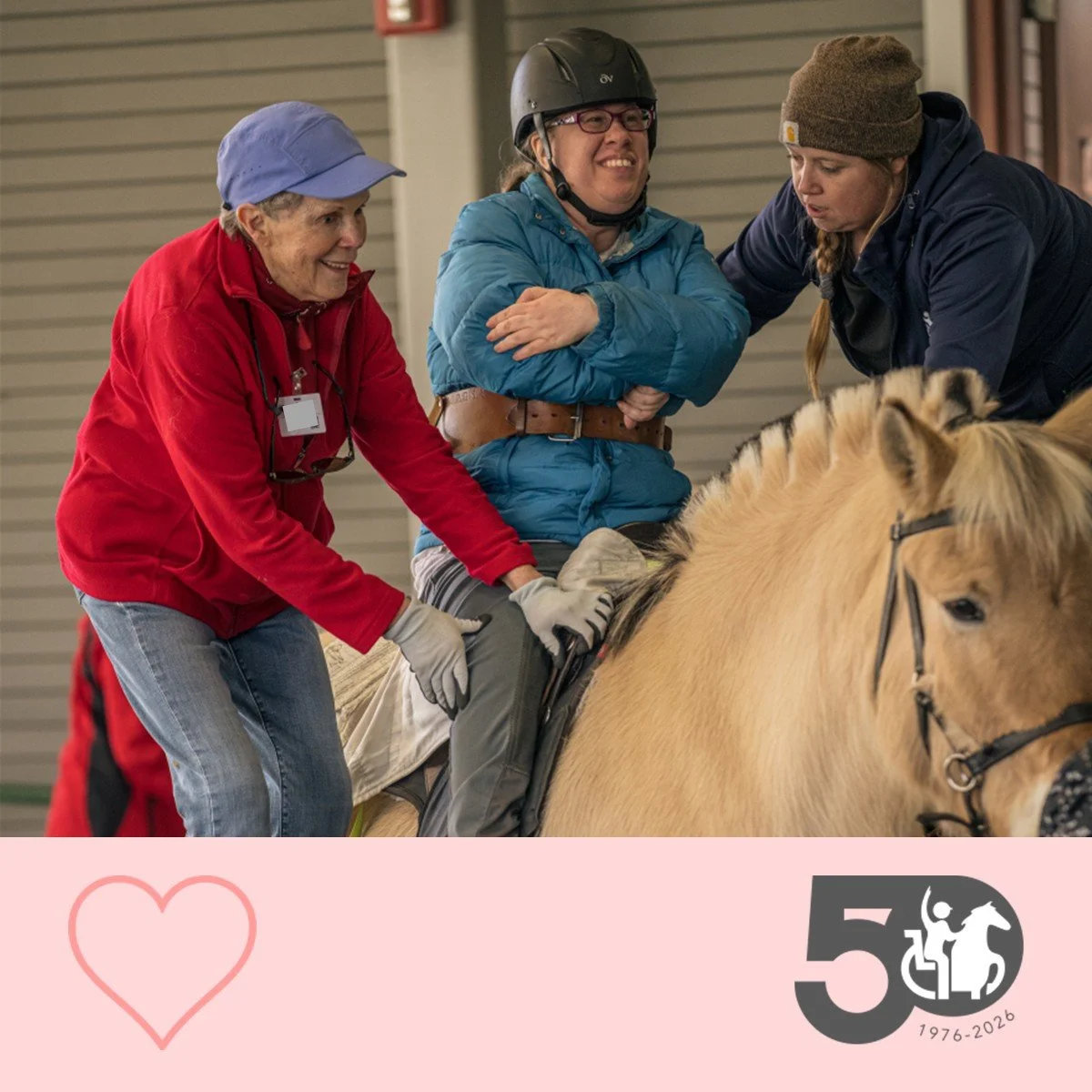 Participant sits on a horse while a volunteer and therapist provide hands-on support during the mount.