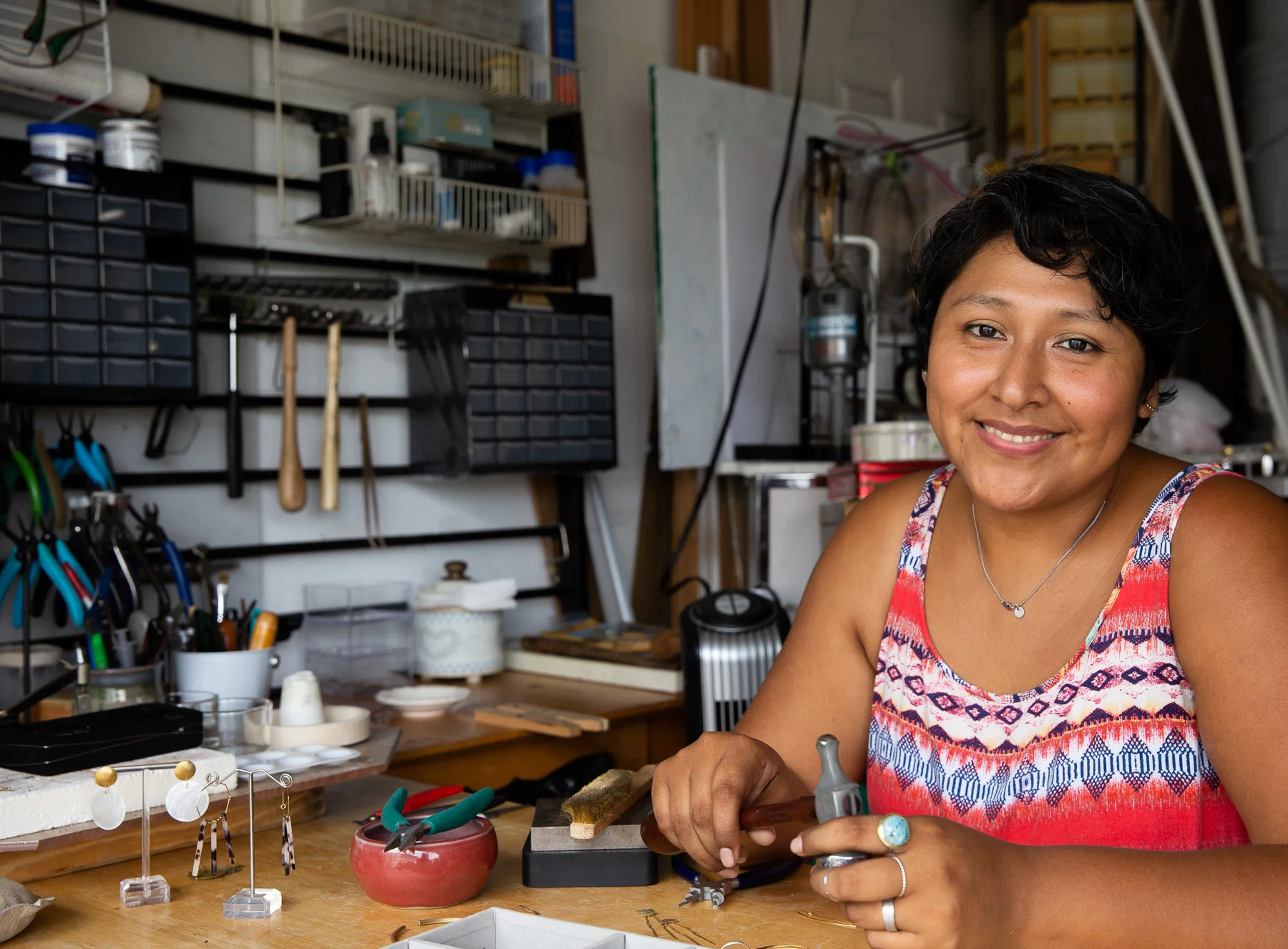 Orlando jewelry designer Carla Poma creating in her studio.