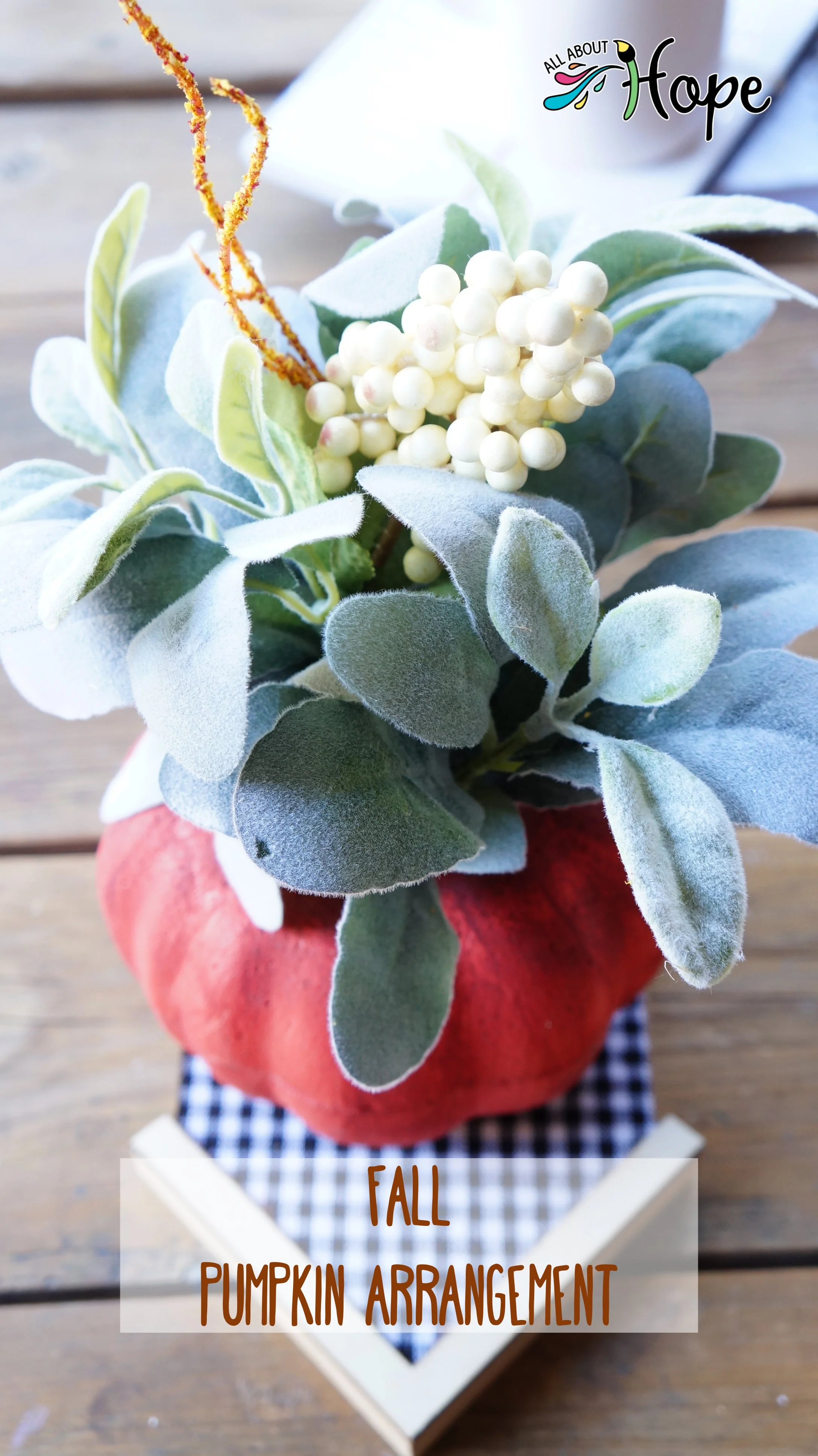 Fall floral arrangement inside pumpkin