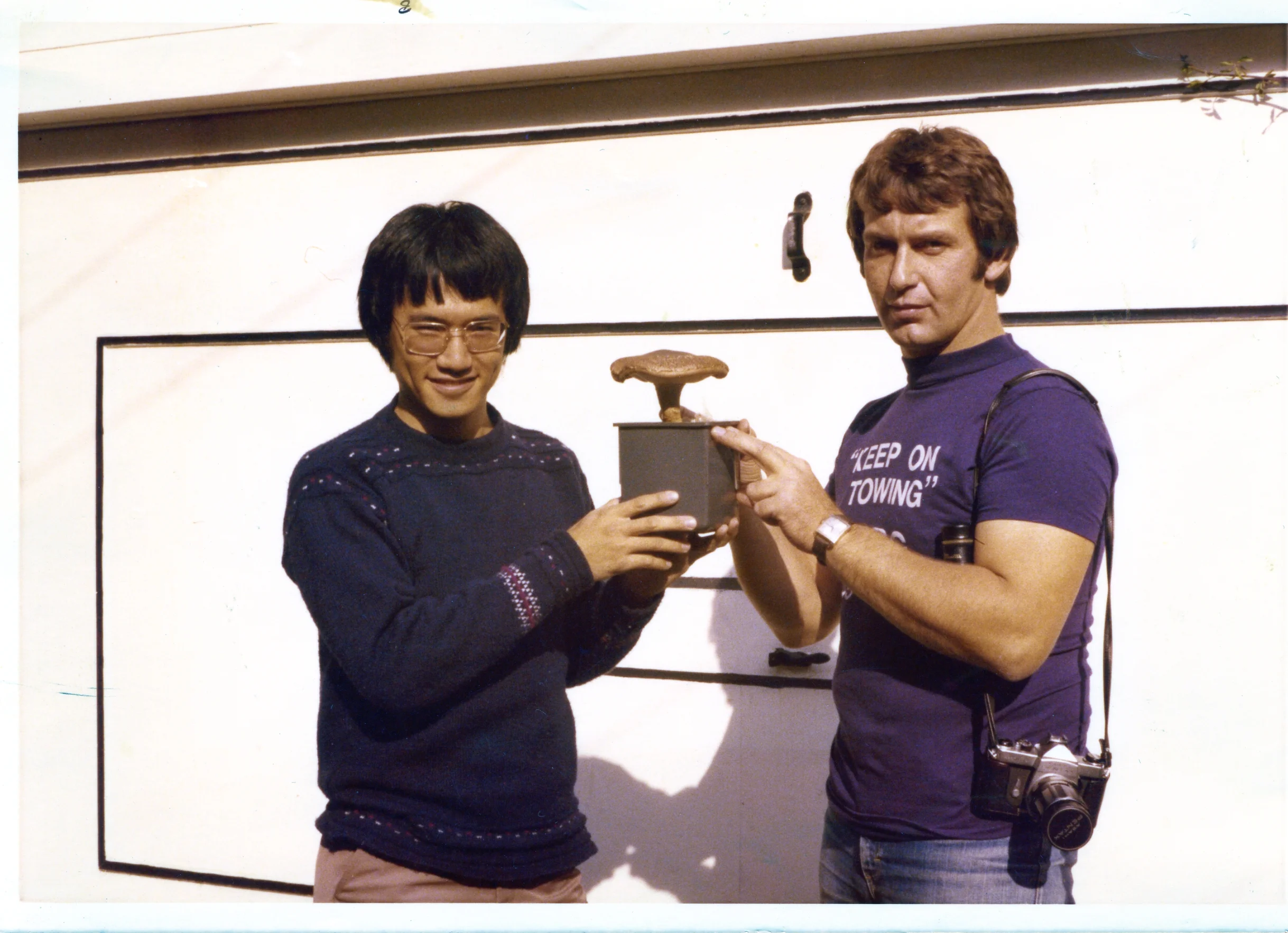 Keep on Towing: Co-founders David Law and Malcolm Clark with their first successfully cultivated shiitake mushroom in 1977