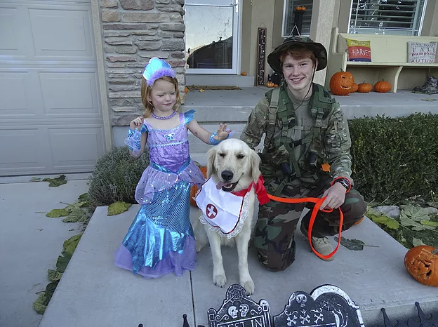 Here is Our Golden Retriever, Pinkerton the nurse, with her Army guy and mermaid!