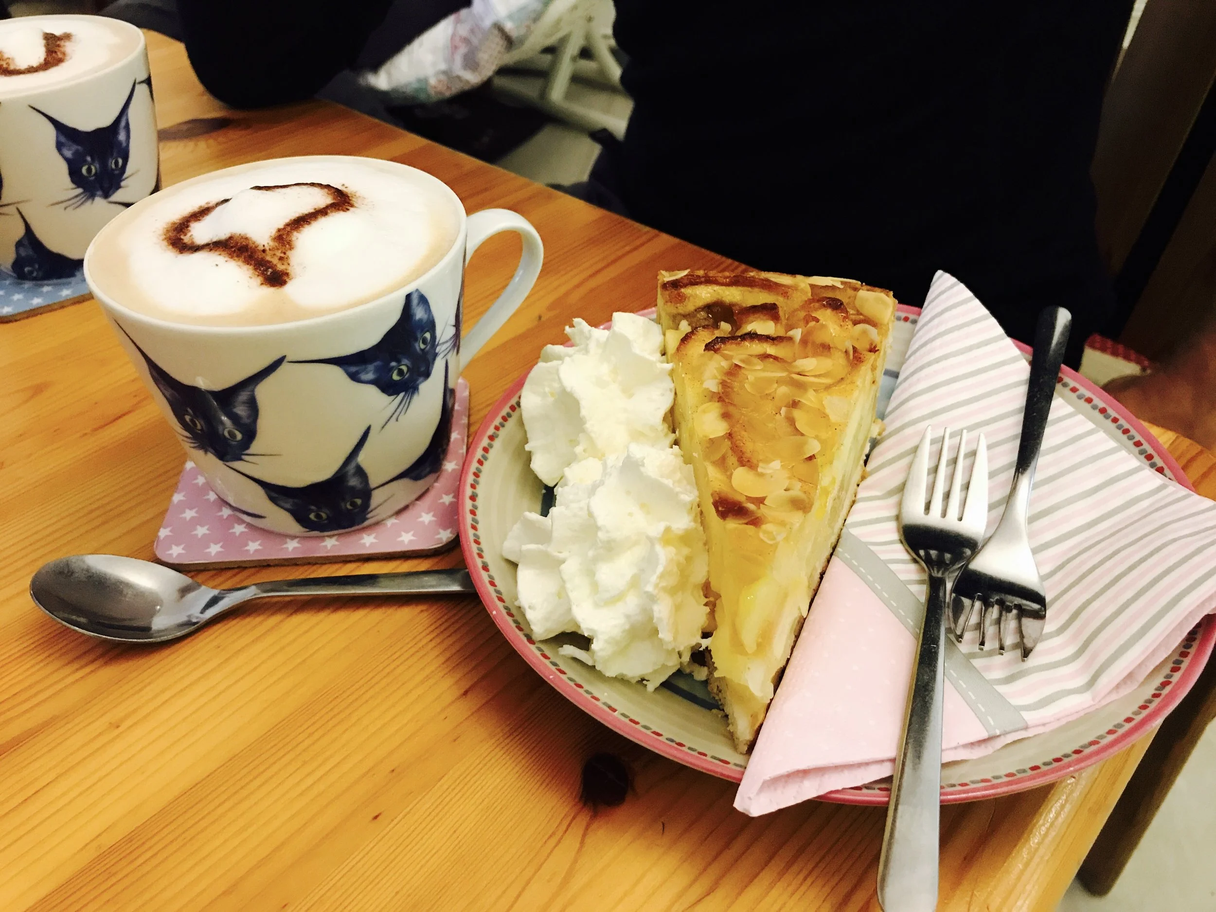 Excellent lattes and apple torte from Pee Pees Katzencafe in Berlin, Germany