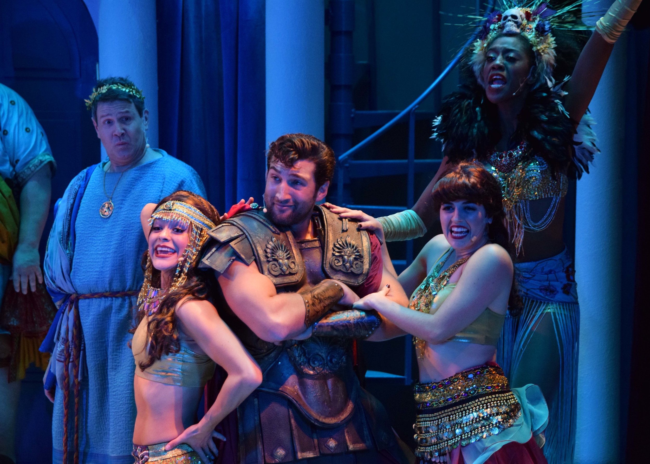  Senex (Kevin Symons) and Miles Glorious (Clayton Snyder) with Courtesans (Liz Bustle, Shamicka Benn, and Vanessa Nichole) in A Funny Thing Happened On The Way To The Forum at the Garry Marshall Theatre. Photo by Chelsea Sutton. 