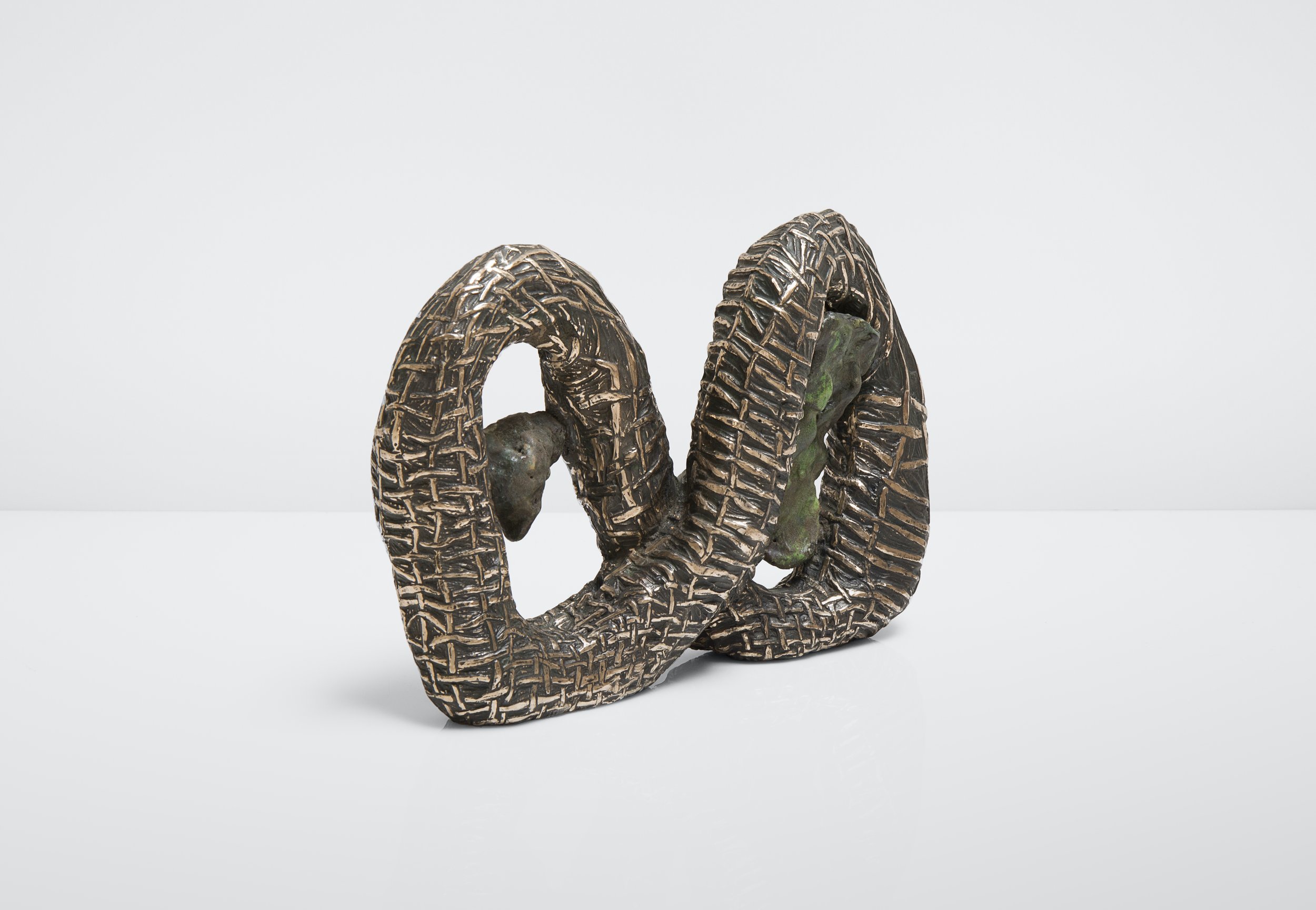   Julia Haft-Candell,  Woven Infinity with Lichen Green , 2021, Bronze and ceramic 1 1/2 x 4 x 1 inches. Photo credit: MacKenzie Goodman.  