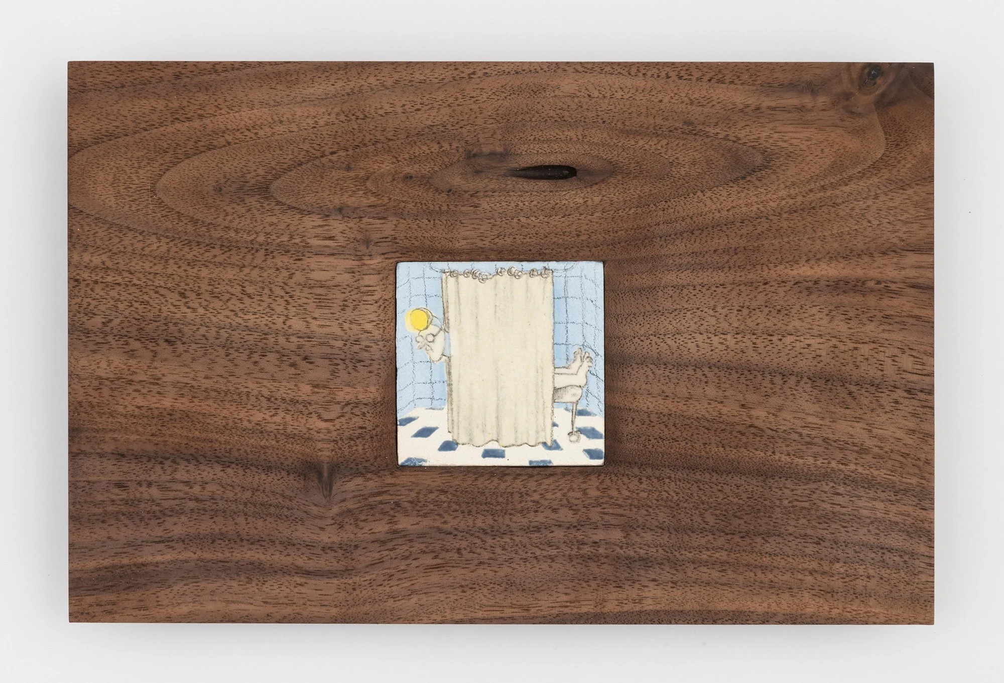   Em Kettner,  Curtain Call (Spotlight Soliloquy) , 2022, Glazed porcelain tile embedded in black walnut ,5 1/2 x 8 1/2 x 1 inches. Photo credit: Adam Reich.  