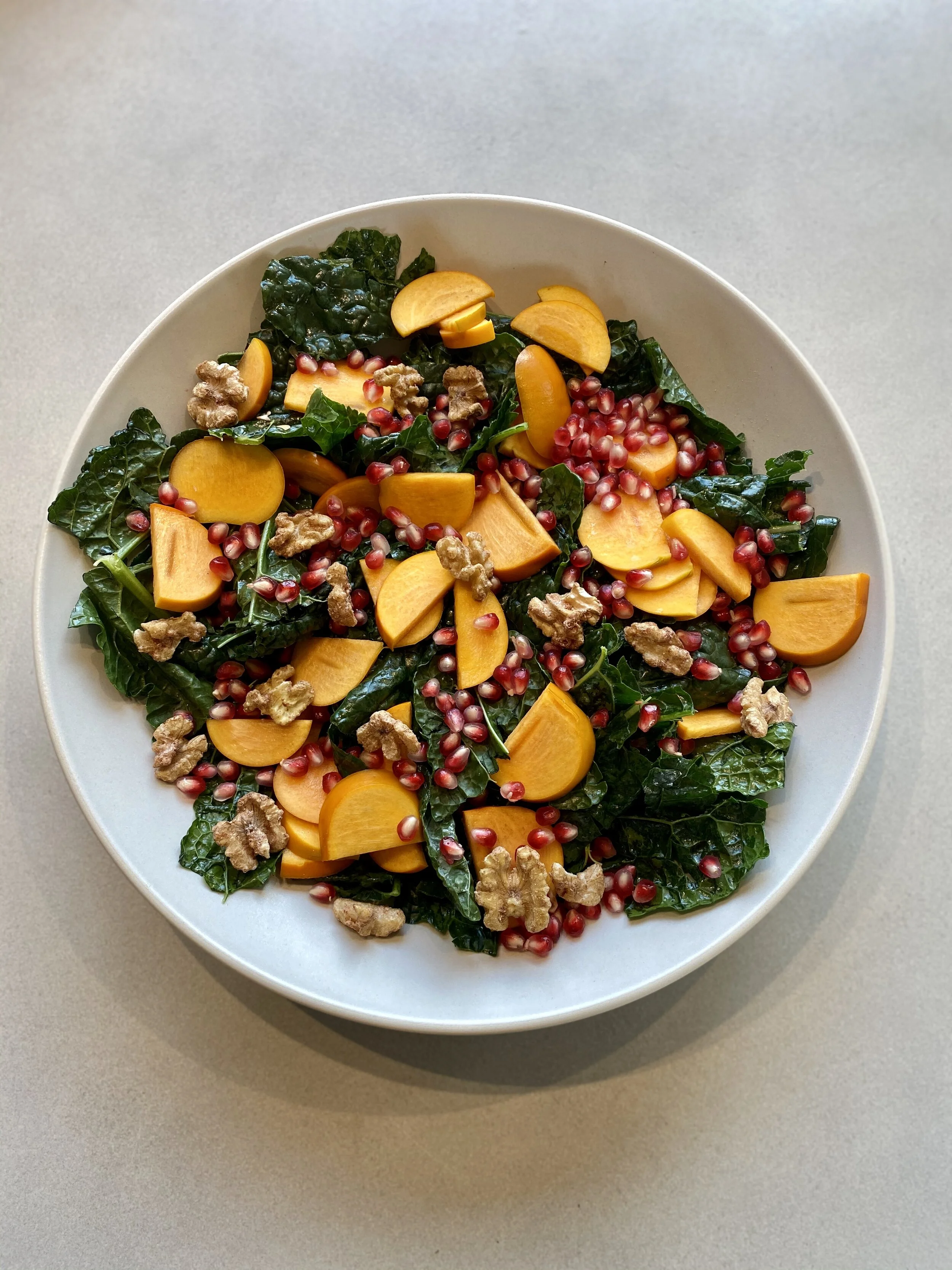 Lacinto Kale Salad with Persimmon, Pomegranate, and Honey-Cumin Dressing
