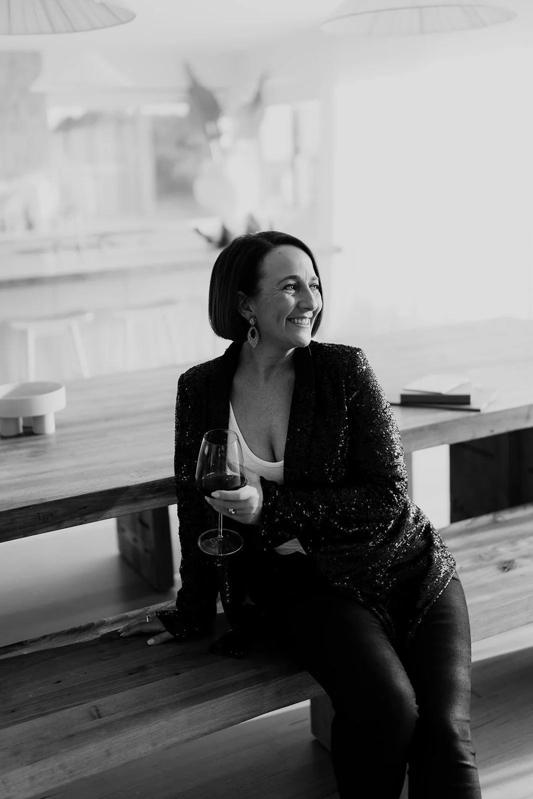 Marriage celebrant, relaxed holding glass of Phillip Island Winery Red wine