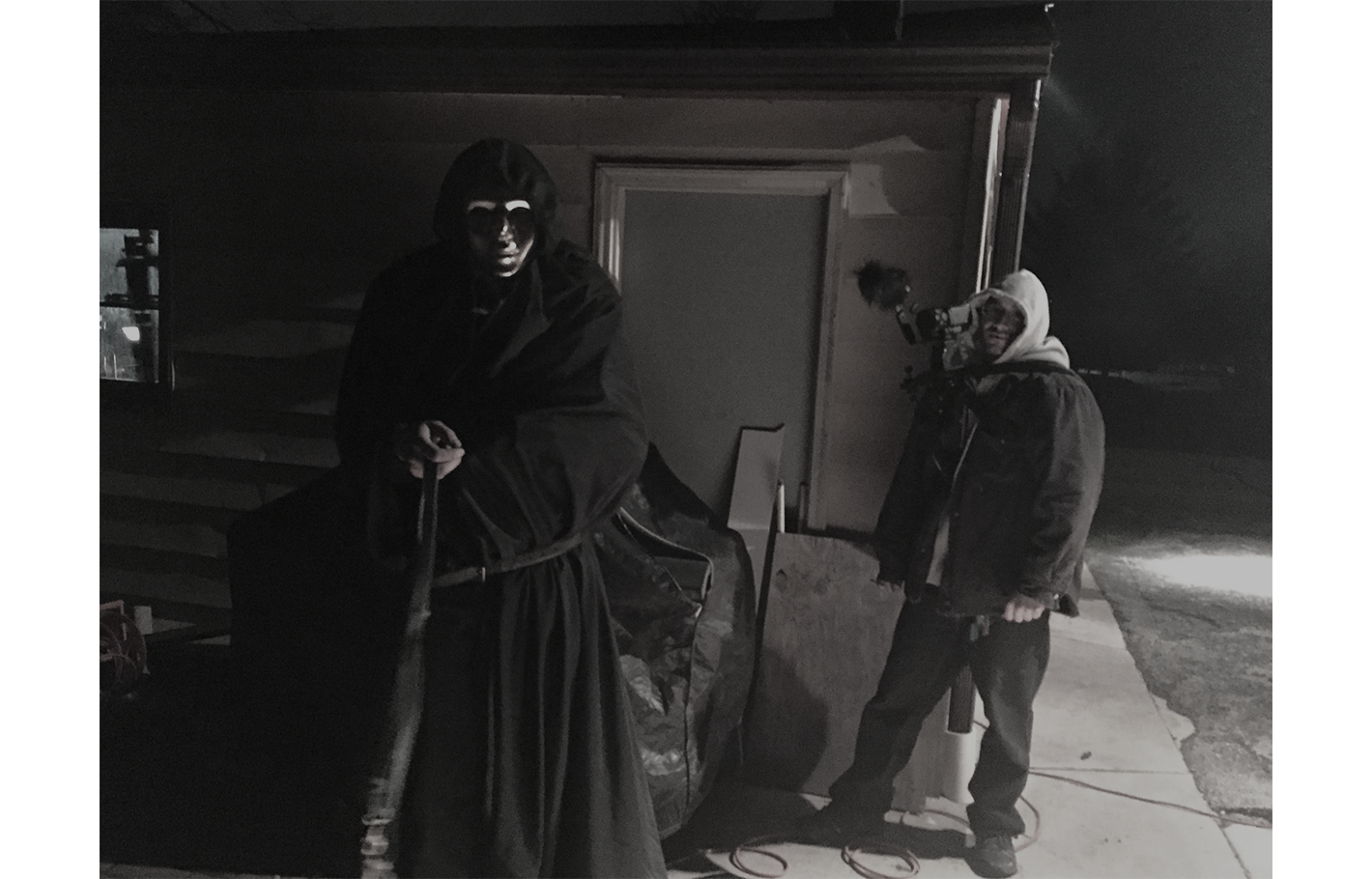 Erick (camera op) and talent between takes during a horror shoot.