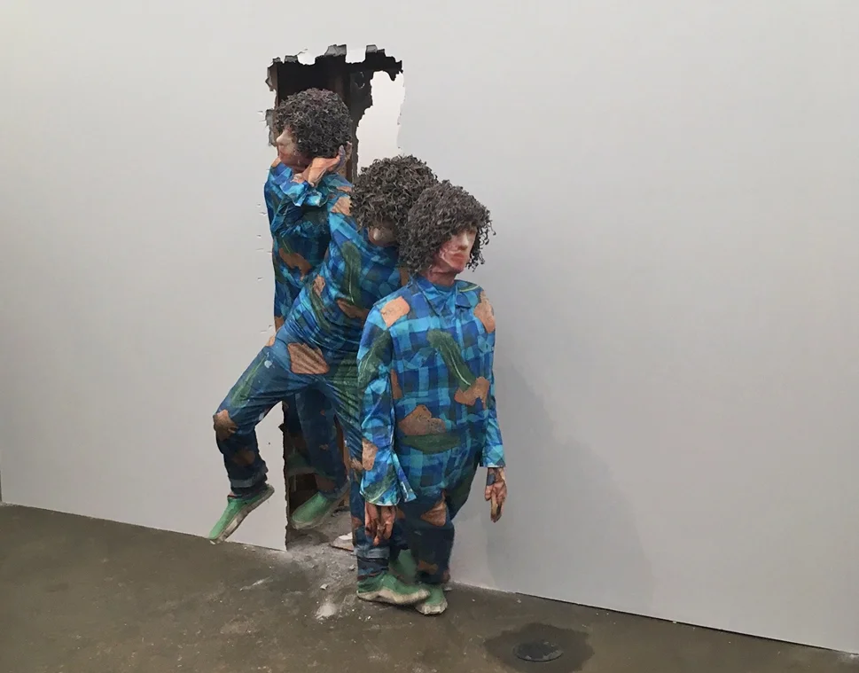 Kennedy Cutler performing, removing Third Self and Fourth Self . Photo by Glen Baldridge, courtesy of the artist. 