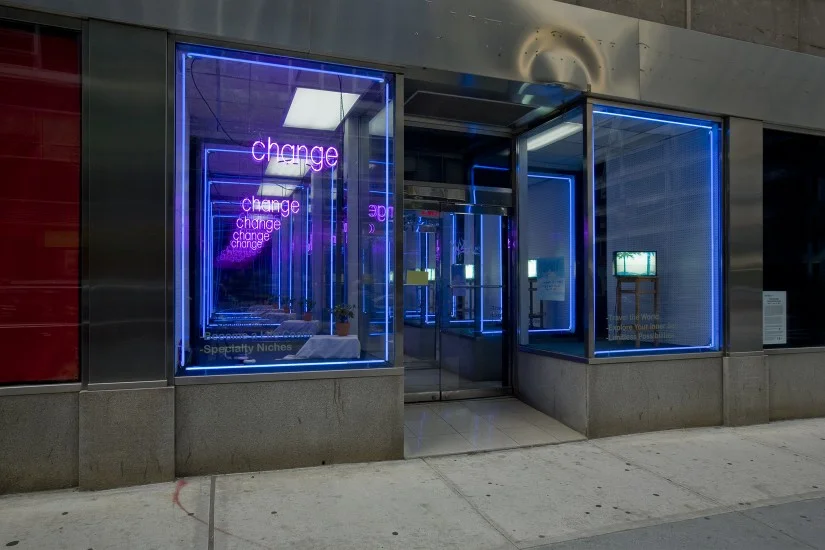 Potential Store Fronts (2007), 9 x 15 x 30 feet, wood, plexi, paint, neon lights, mylar and other faux surfaces, light boxes, vinyl lettering, carpet, fake plants, exit signs, misc