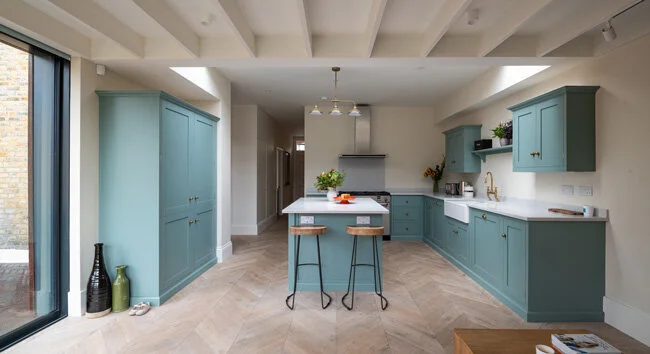 Devol kitchen with exposed roof joists and white oak floor by Lendel Stephens Architects