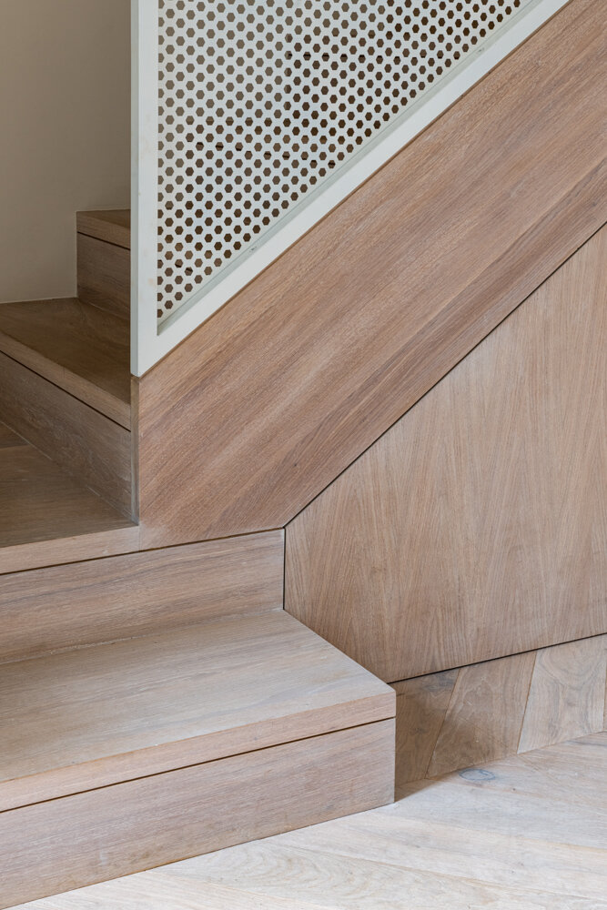 White Oak bespoke staircase with perforated metal balustrade by Lendel Stephens Architects