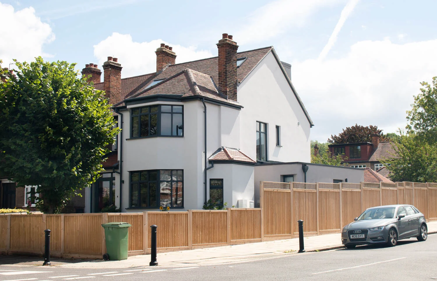 Insulated render and hip to gable roof conversion by Lendel Stephens Architects