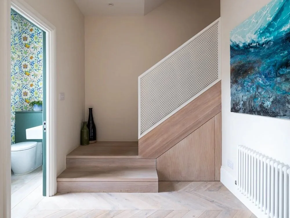 The reoriented staircase and entrance room at Lordship Lane, with the cloakroom opening off it.