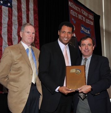 William Gaine, the MIAA Deputy Director, (left) and Steve Burton of WBZ-TV (center) present the 2010 Ron Burton Community Service Award to Dave McGillivray, president of DMSE Sports, Inc. GrynnAndBarrett