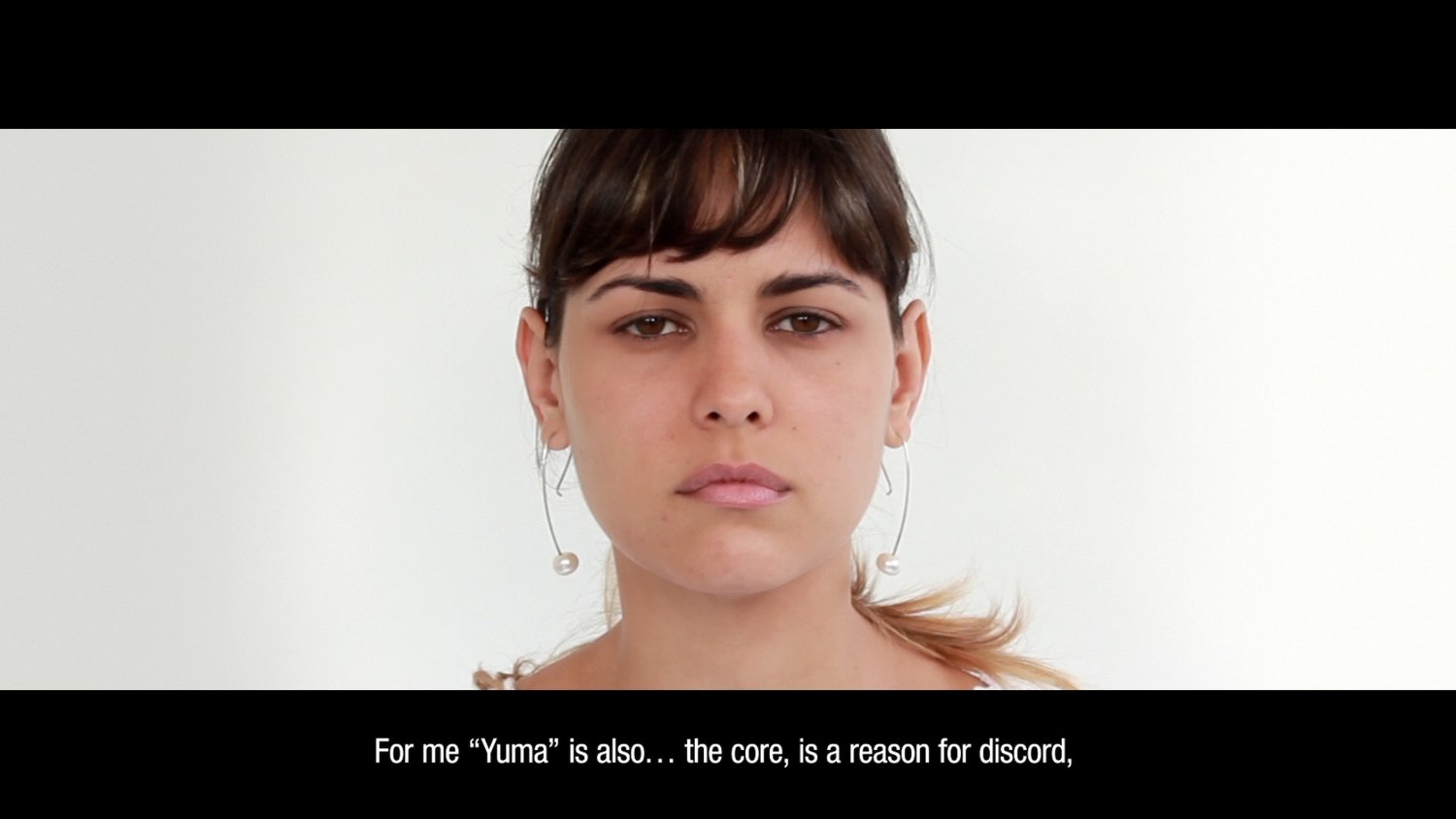 Mari Claudia García Genealogy of the Metaphor , 2016 Video-installation/action. Video screening, postcards, wood shelf Variable dimensions ED. 3, 1 artist proof.