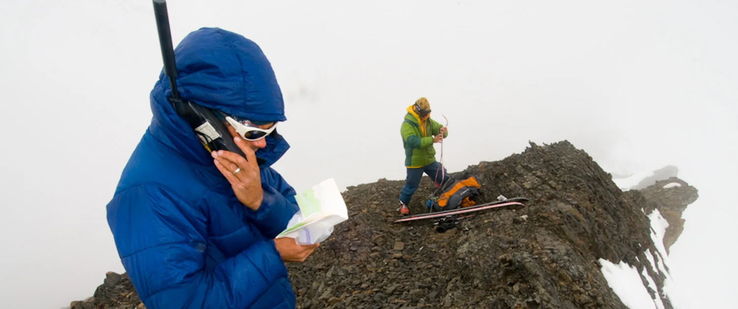 Joe calling Meekin Air Service at the north end of the Tordrillo Mountains, Alaska. Photo by Dylan Taylor.