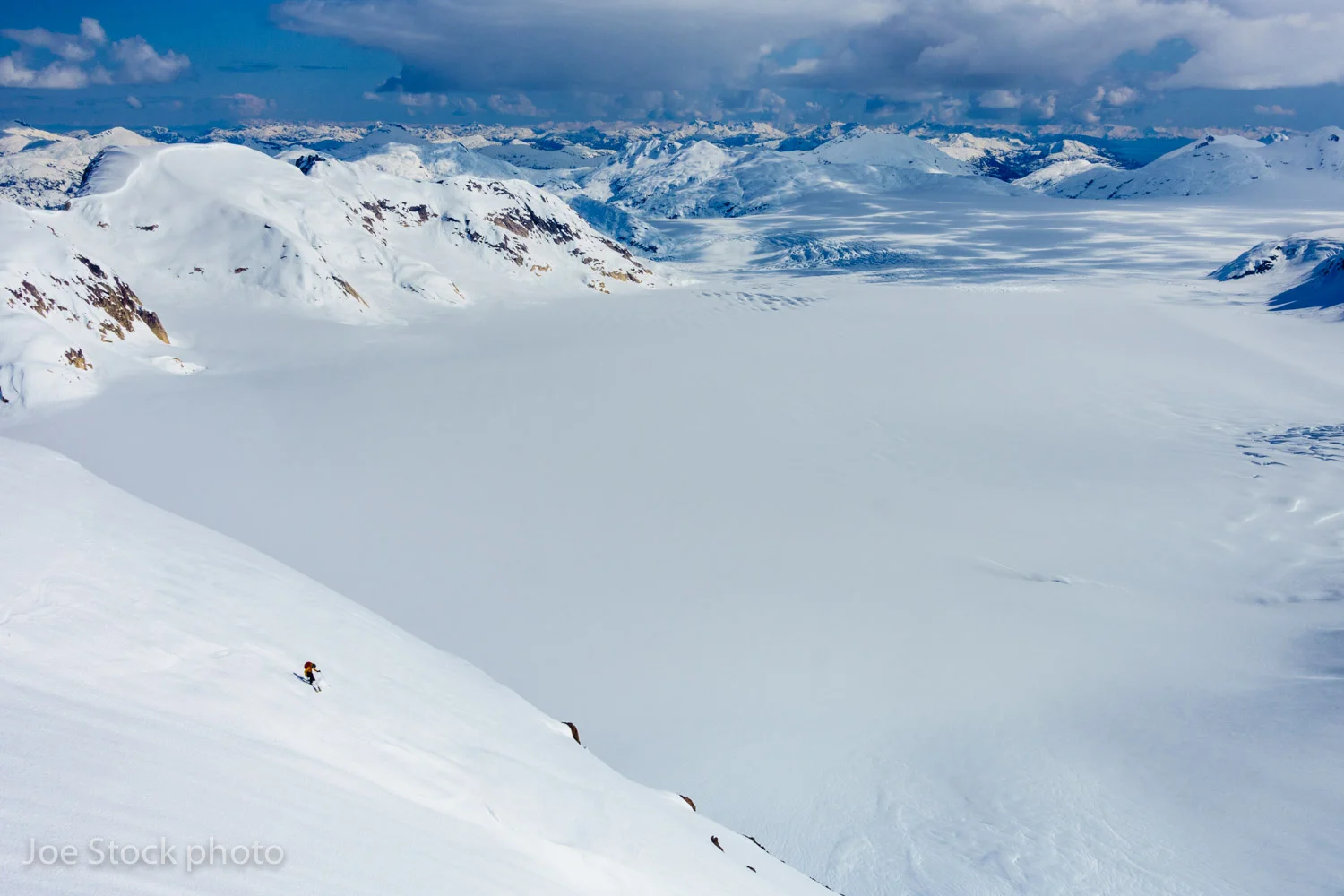 Tobey Carman skis 2,500-feet of corn in Prince William Sound in mid-April. Cathy, Tobey, Cortney, Eric Larson and I spent an epic week out here, skiing chutes and faces off nunataks above the ocean and icefields.