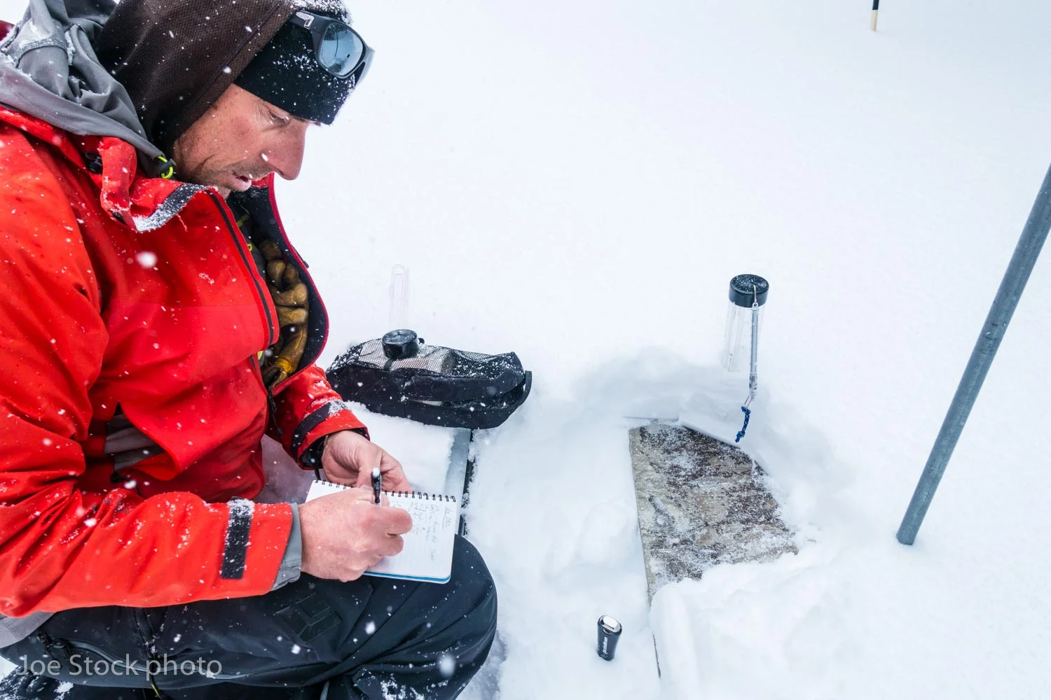John Fitzgerald takes snow board measurements.