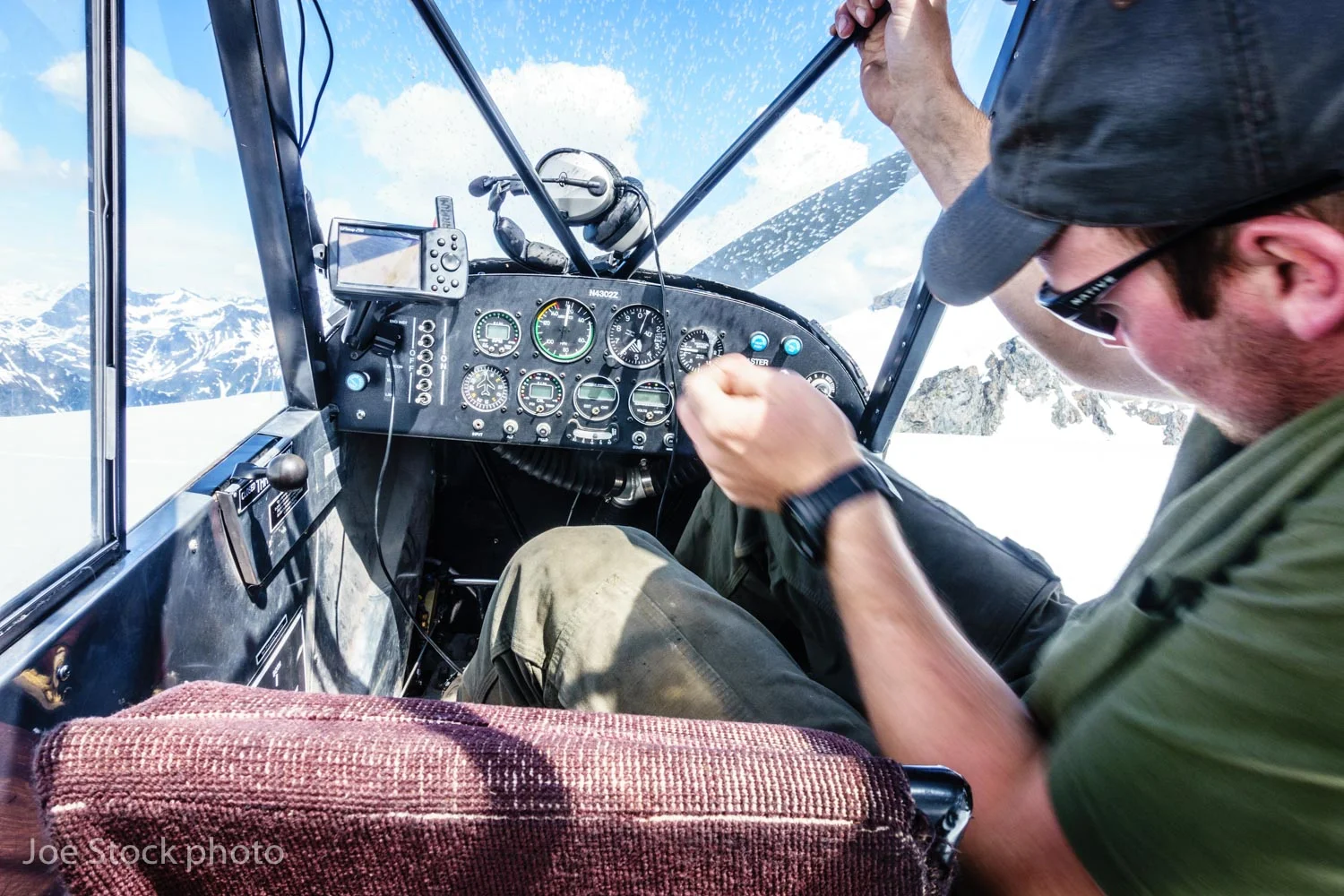 Ben landed the Cub on a broad glacial ridge surrounded by numerous peaks and extruded himself from the plane. Fortunately, back at Lake Hood in Anchorage, minutes before getting on the plane, I downloaded a low-res map of the entire Neacola and Chigmit region onto my phone. When I located myself on the phone, I learned our location: Double Glacier in the Chigmit Mountains. Oh yeah!