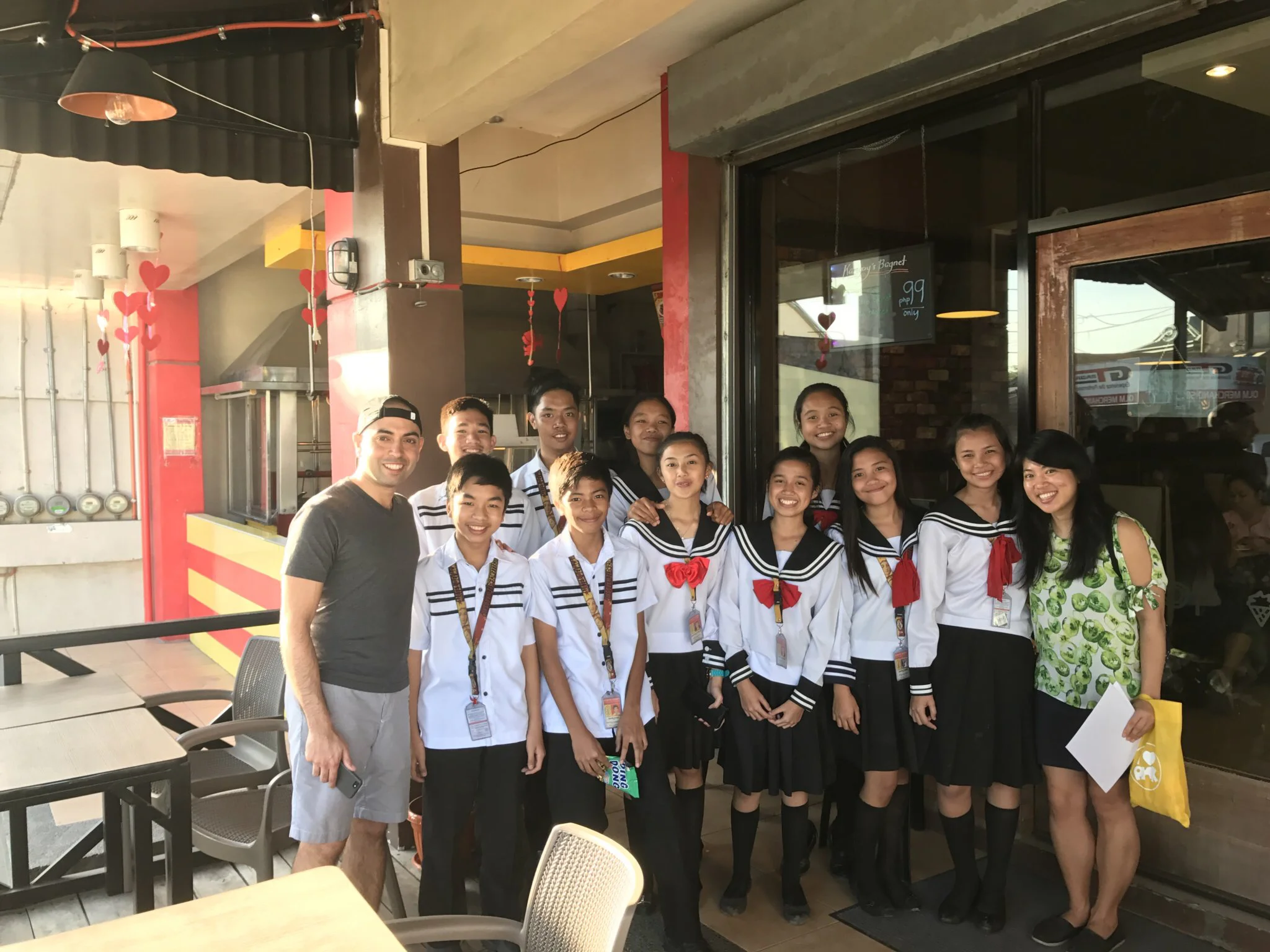 MDA - Cathy and Ben w scholars at restaurant.jpeg