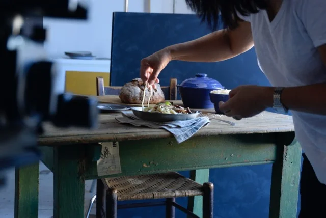 Setting the stage. And trying not to eat the props.